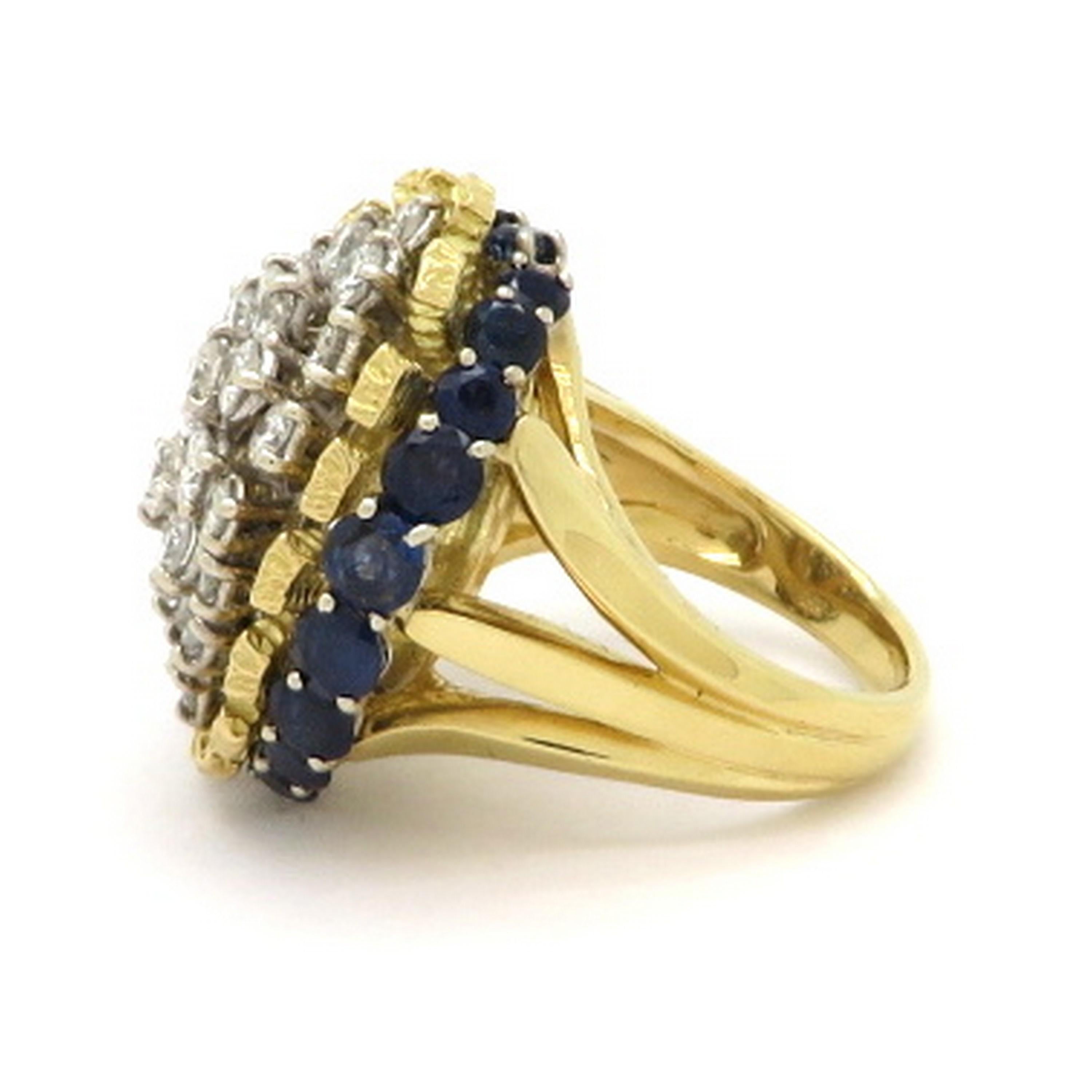 Estate platinum and 18K yellow gold 3.00 carat diamond and Sapphire cluster ring. Showcasing 25 round brilliant cut diamonds, prong set, weighing a combined total of approximately 3.00 carats. Interspersed with 20 round brilliant cut prong set fine