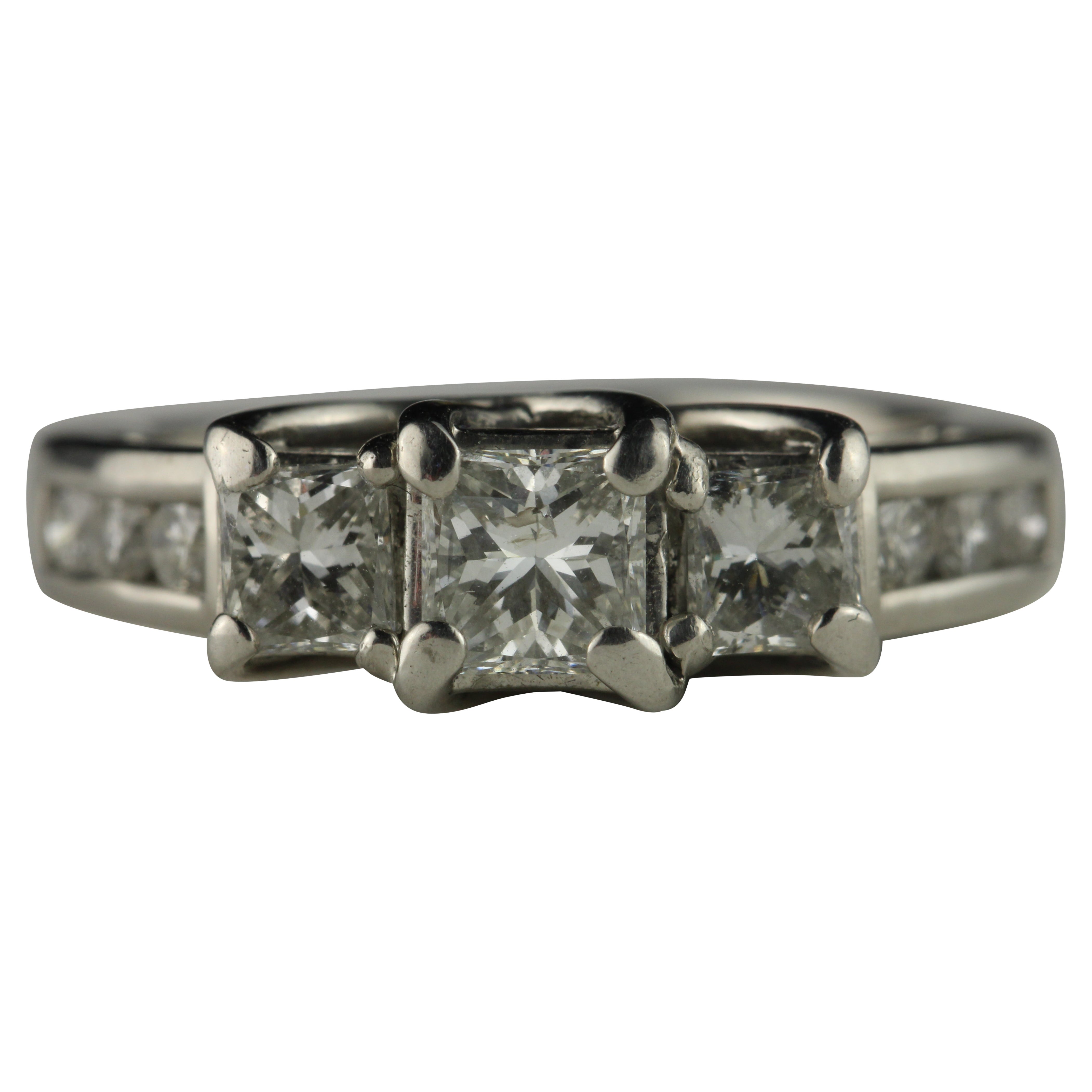 What does the 3 diamonds on an engagement ring mean?