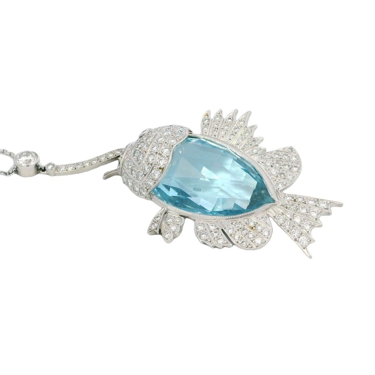 Estate Aquamarine Diamond Fish on a Hook Platinum Pendant Necklace ~18.1ctw

This one-of-a-kind pendant necklace brings a playful yet refined take on marine-inspired design. At its center is an approximately 16.0-carat pear-cut aquamarine, with a