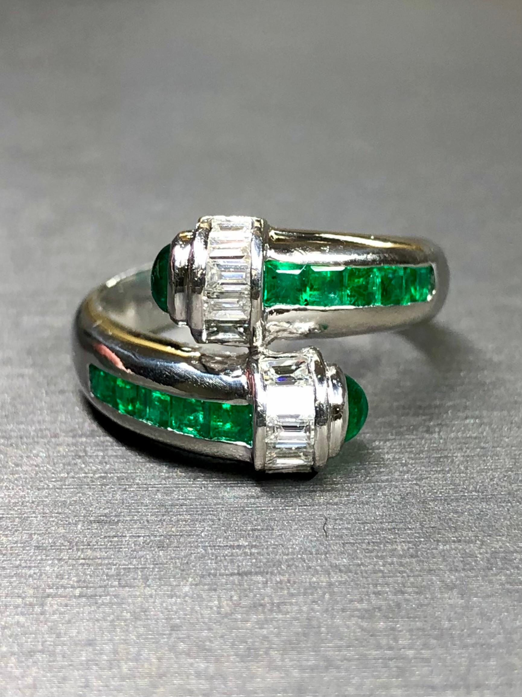 An absolutely stunning bypassing handcrafted in heavy platinum and set with approximately 2.10ctw in cabochon and baguette cut, vivid green natural emeralds as well as 1ctw in G-H color Vs1-2 clarity baguette cut diamonds.


Dimensions/Weight:

The
