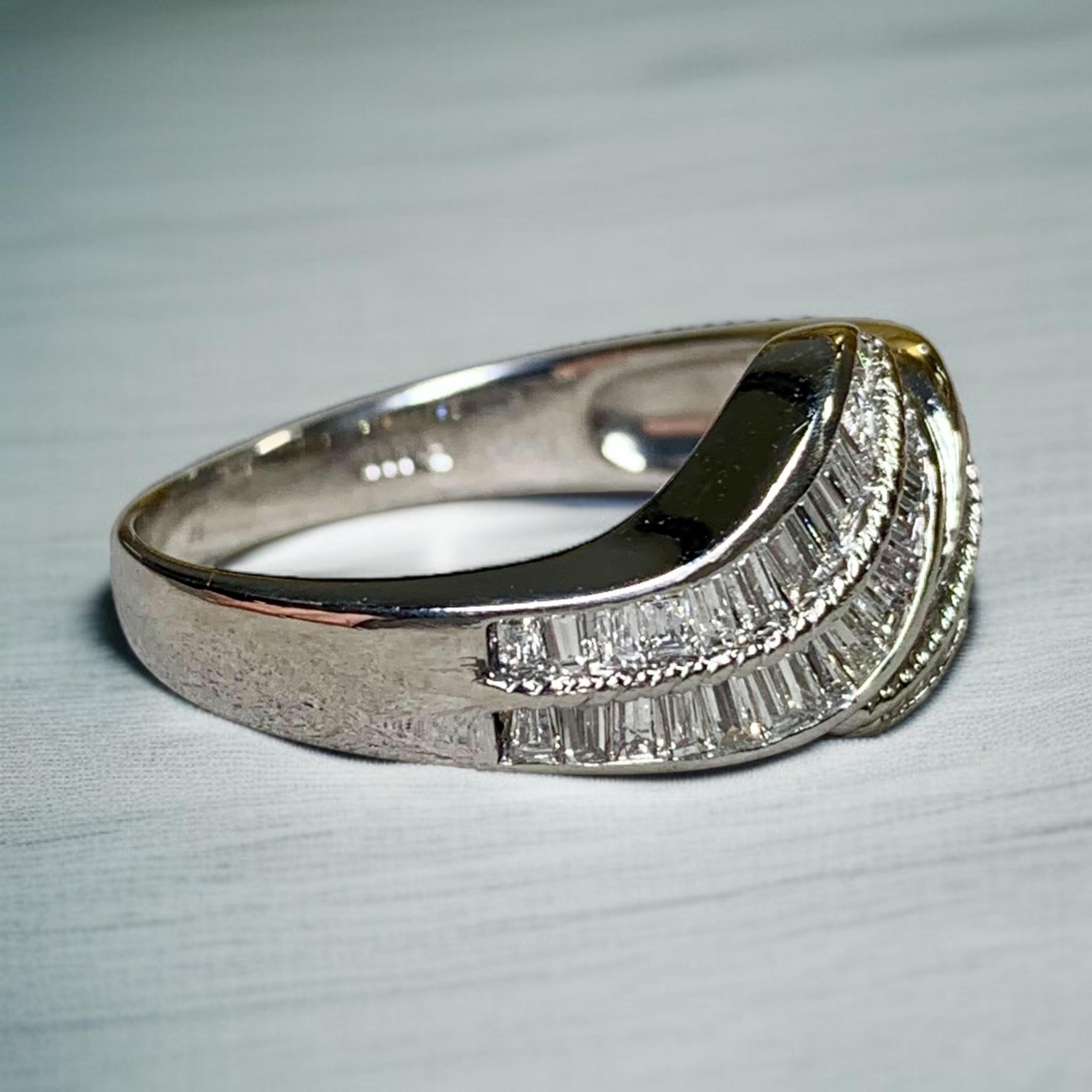 
A contemporary ring done in platinum in a bypass design channel set with approximately 1.90ctw inH-I color Vs2-Si1 clarity straight and tapered baguette diamonds.


Dimensions/Weight:

This ring measures .45” top to bottom and weighs 7.7g. Size