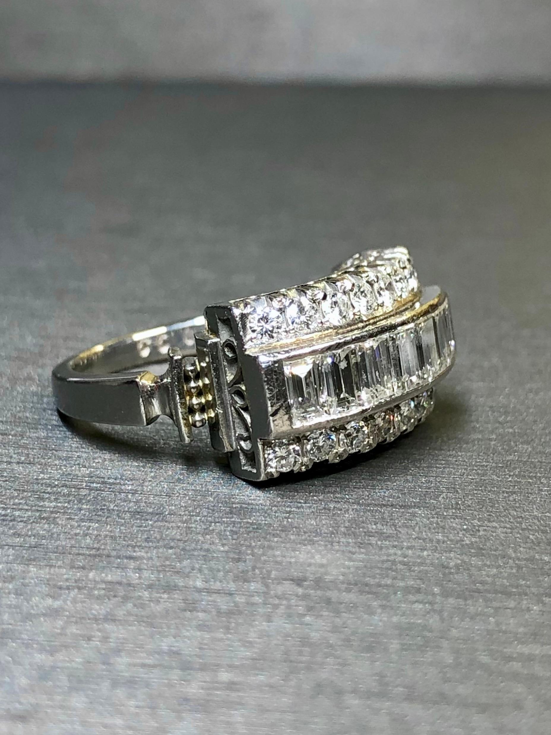 A gorgeous vintage ring done in platinum and set with larger baguettes and round diamonds. Total weight is 1.40ctw (stamped) and all stones are a beautifully matching G-H color and Vs1-2 clarity diamonds. Beautiful attention to detail in a timeless