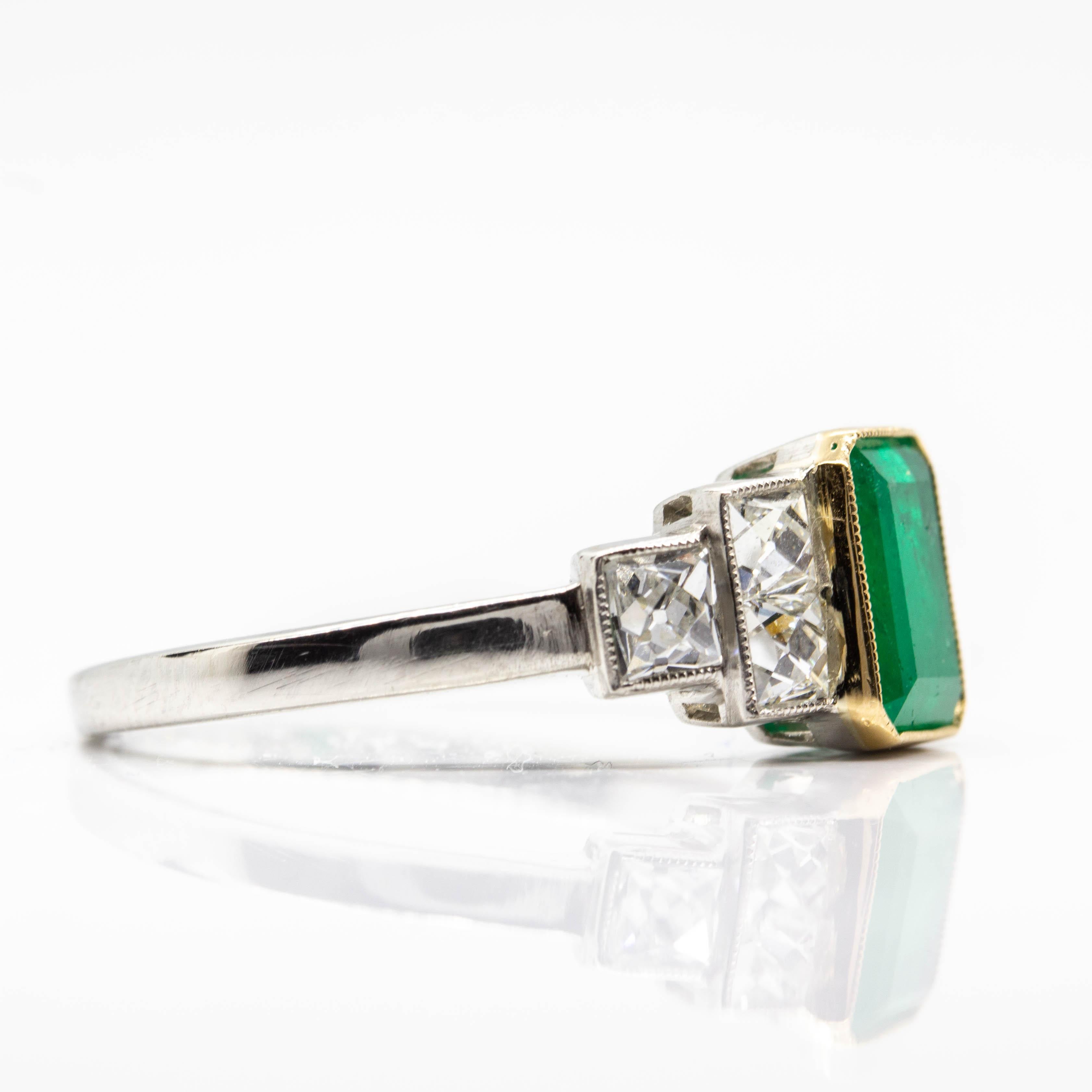 Composition: Platinum 
•	1 natural Colombian emerald 1.25ctw.
•	6 French cut diamonds H-VS1 0.90ctw.
Ring size: 7 ½ 
Ring face measure: 8mm x 15mm 
Rise above finger: 5mm
Total weight: 4.2 grams – 2.7dwt
