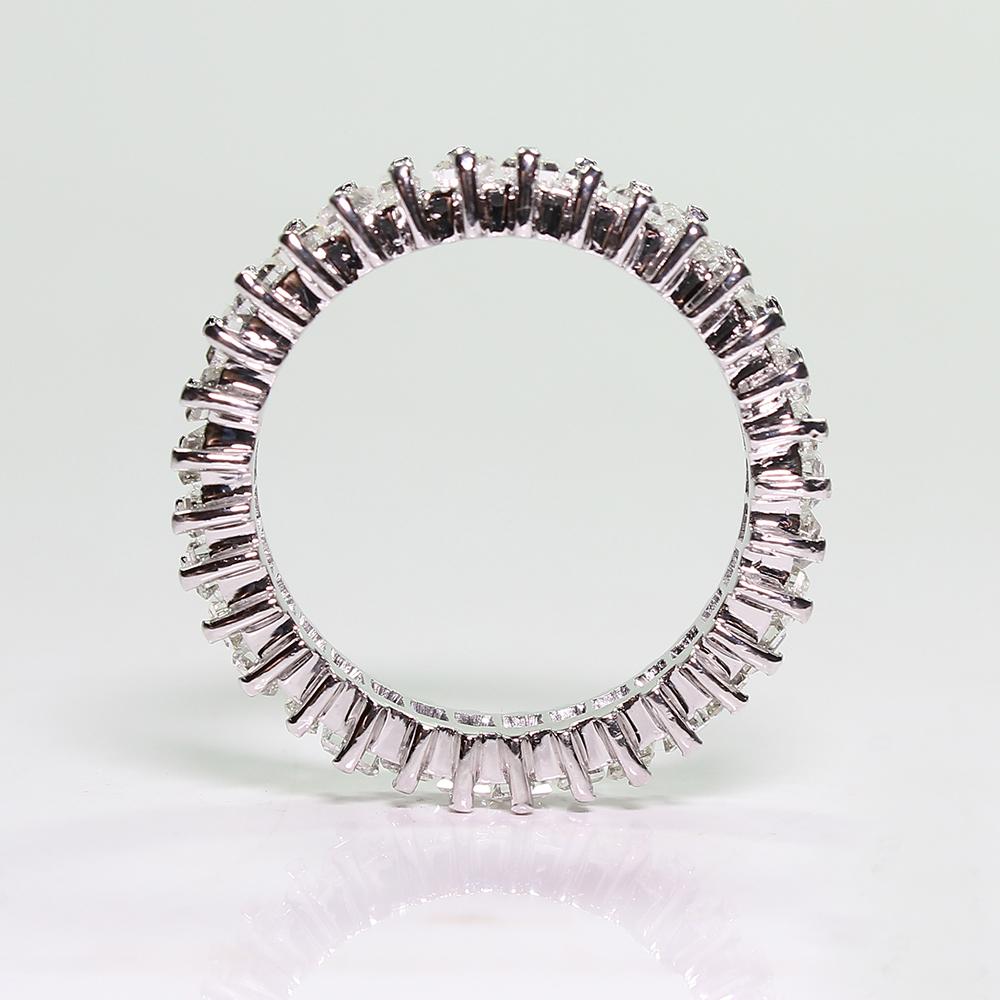 Composition: Platinum.

Stones:
•	36 baguette cut diamonds of H-VS2 quality that weigh 3.20ctw.
Ring face:  5mm by 3mm 
Total weight:  6.3grams – 4.1dwt
This purchase comes with a professional appraisal document for the amount of: $10000 (Upon