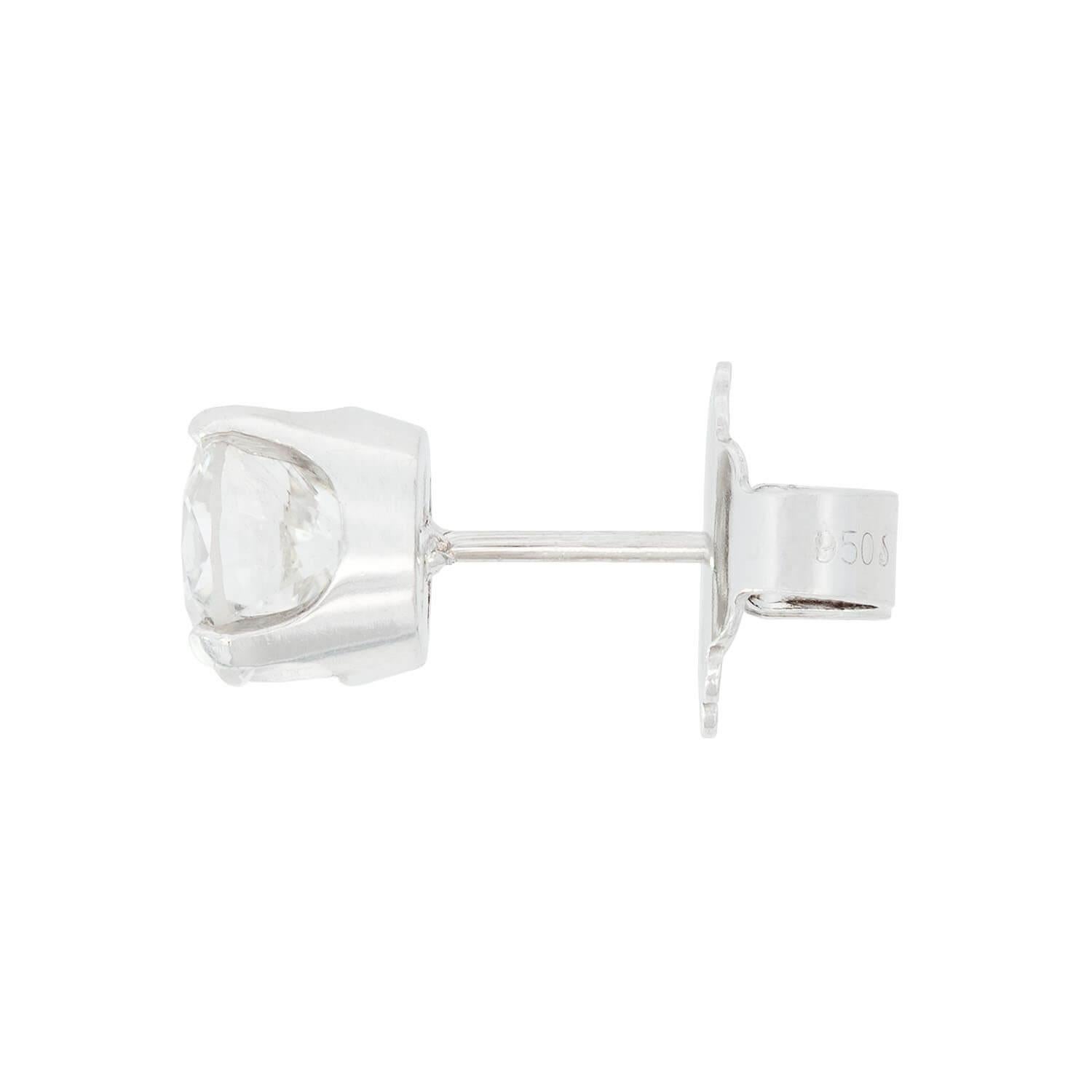 A gorgeous pair of Estate diamond stud earrings! Crafted in platinum, each stud earring features a four-prong set transitional cut diamond. The diamonds display H/I color and SI1-SI2 clarity. Together, the two diamonds have an approximate total