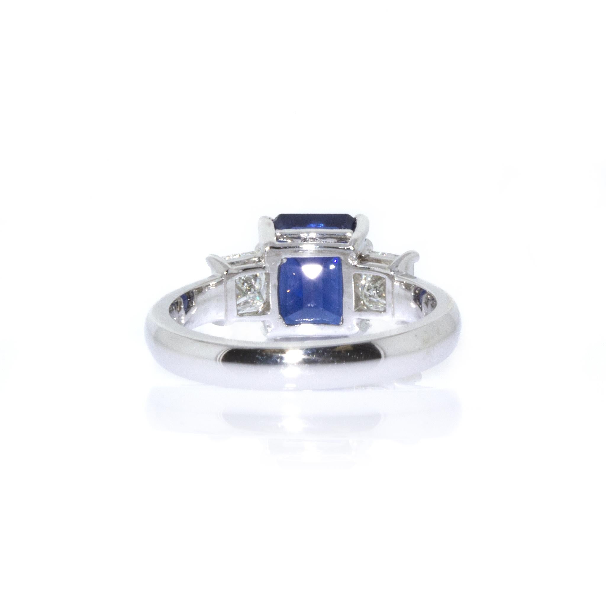 Estate Platinum Emerald Cut Sapphire and Diamond Ring In Excellent Condition For Sale In New York, NY