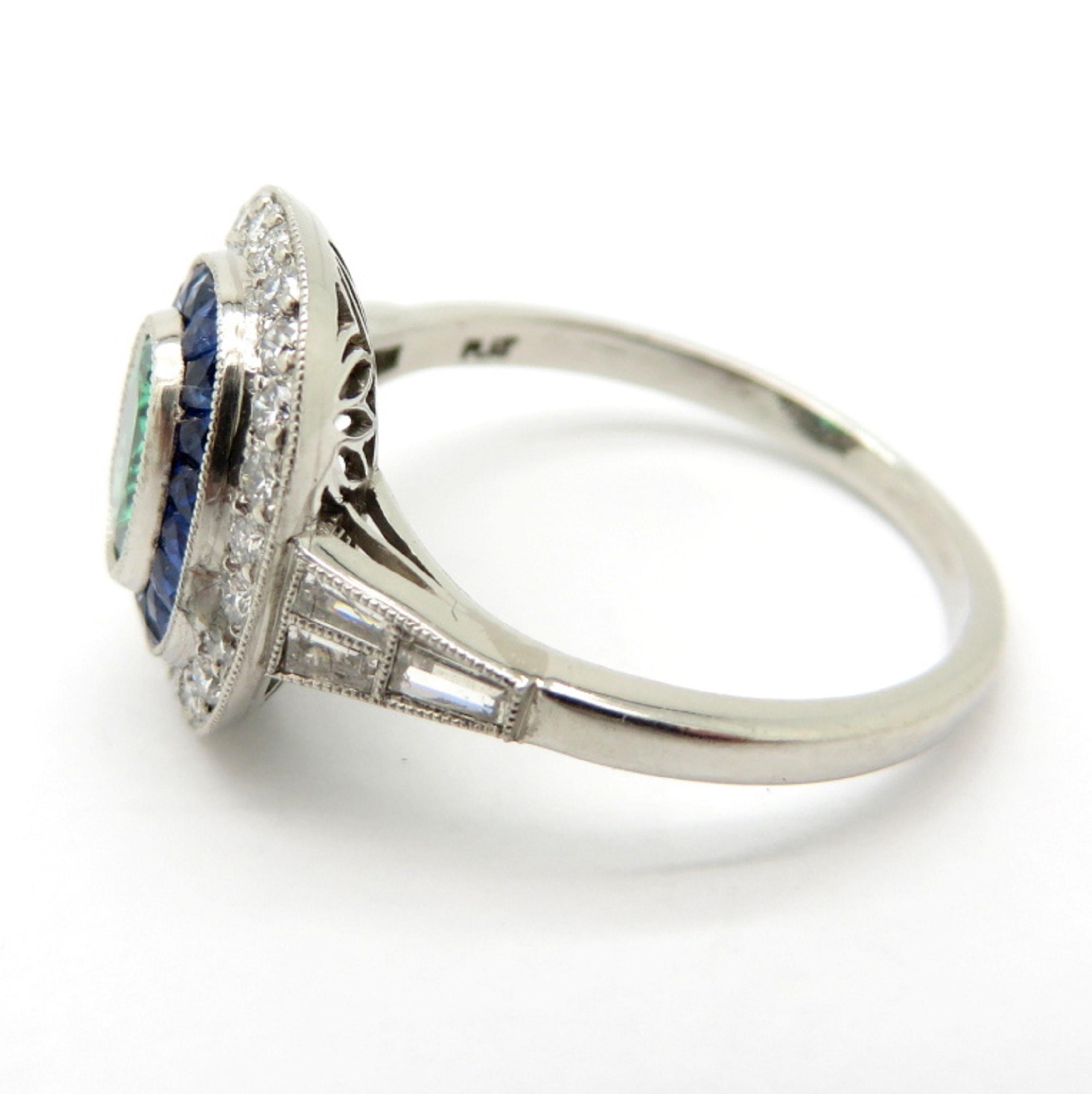 Oval Cut Estate Platinum Emerald, Sapphire and Diamond Halo Ring