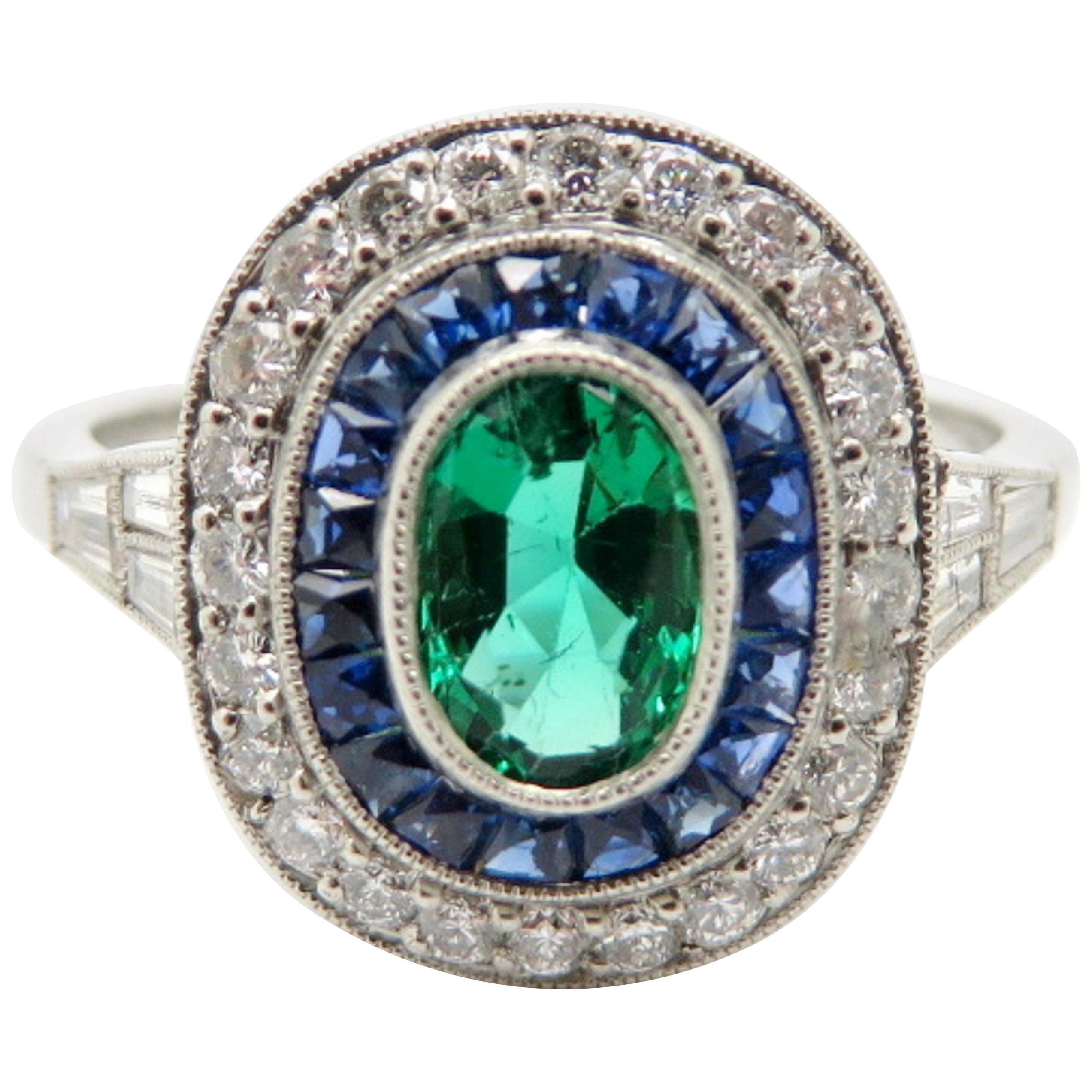 Estate Platinum Emerald, Sapphire and Diamond Halo Ring