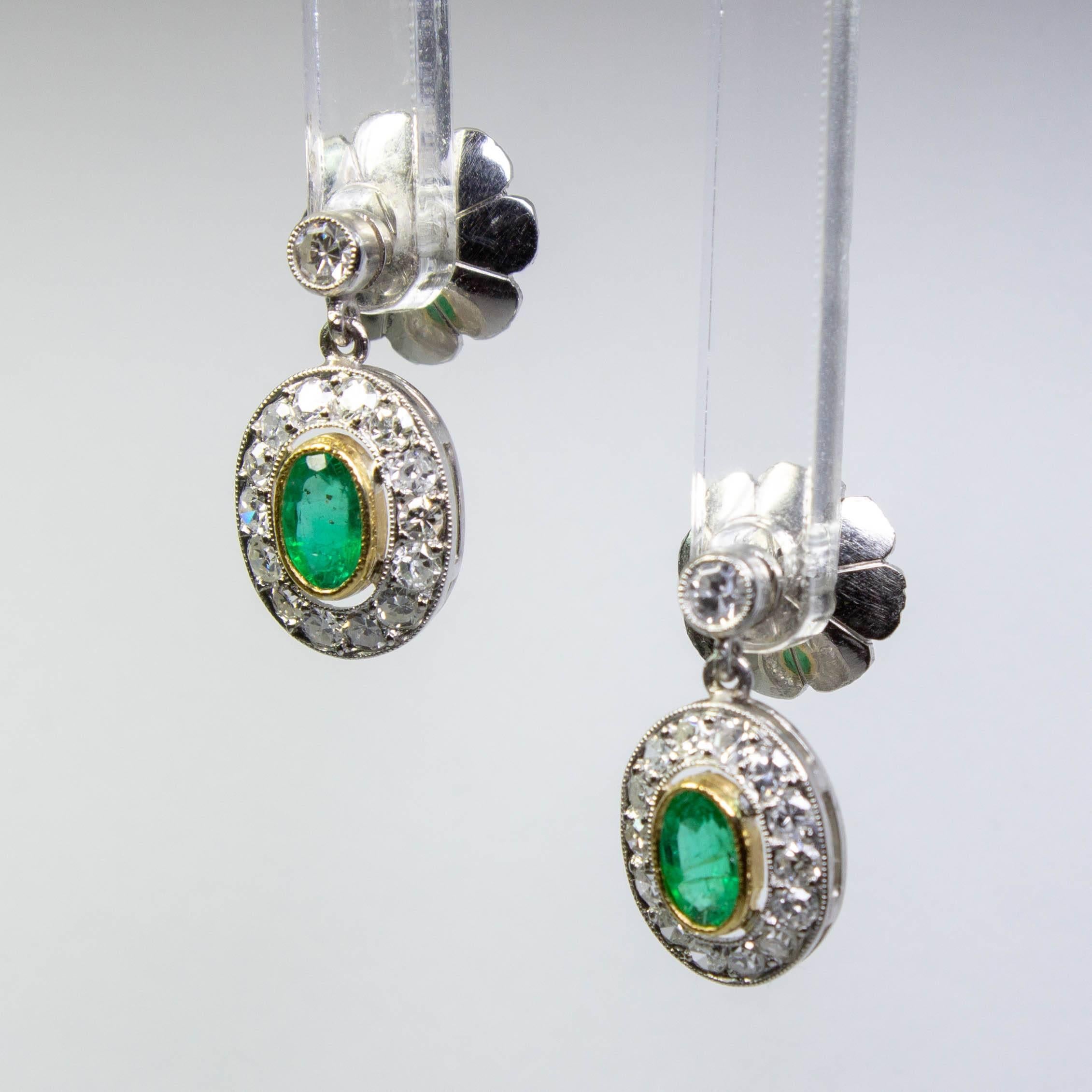 Period: Edwardian (1901-1920)

Composition: Platinum.
Stones: 
•	2 natural oval cut emeralds that weigh 0.46ctw. (0.23ctw. each).
•	30 Single cut diamonds of I-VS2 quality that weigh 0.71ctw.

Earrings measure: 16mm by 8mm 
Thick: 4mm
Total weight: