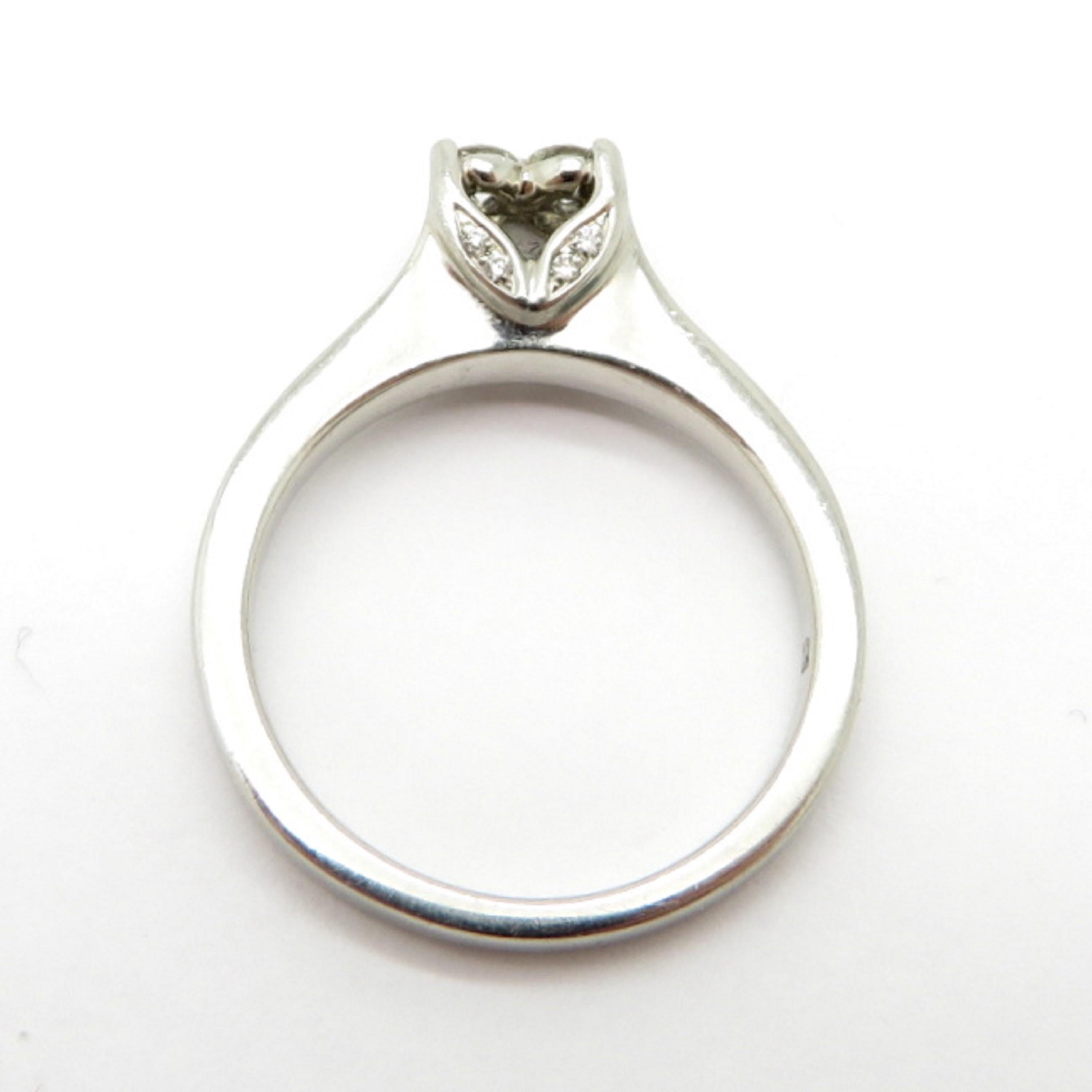 Estate Platinum Flower Round Diamond Engagement Ring In Excellent Condition For Sale In Scottsdale, AZ