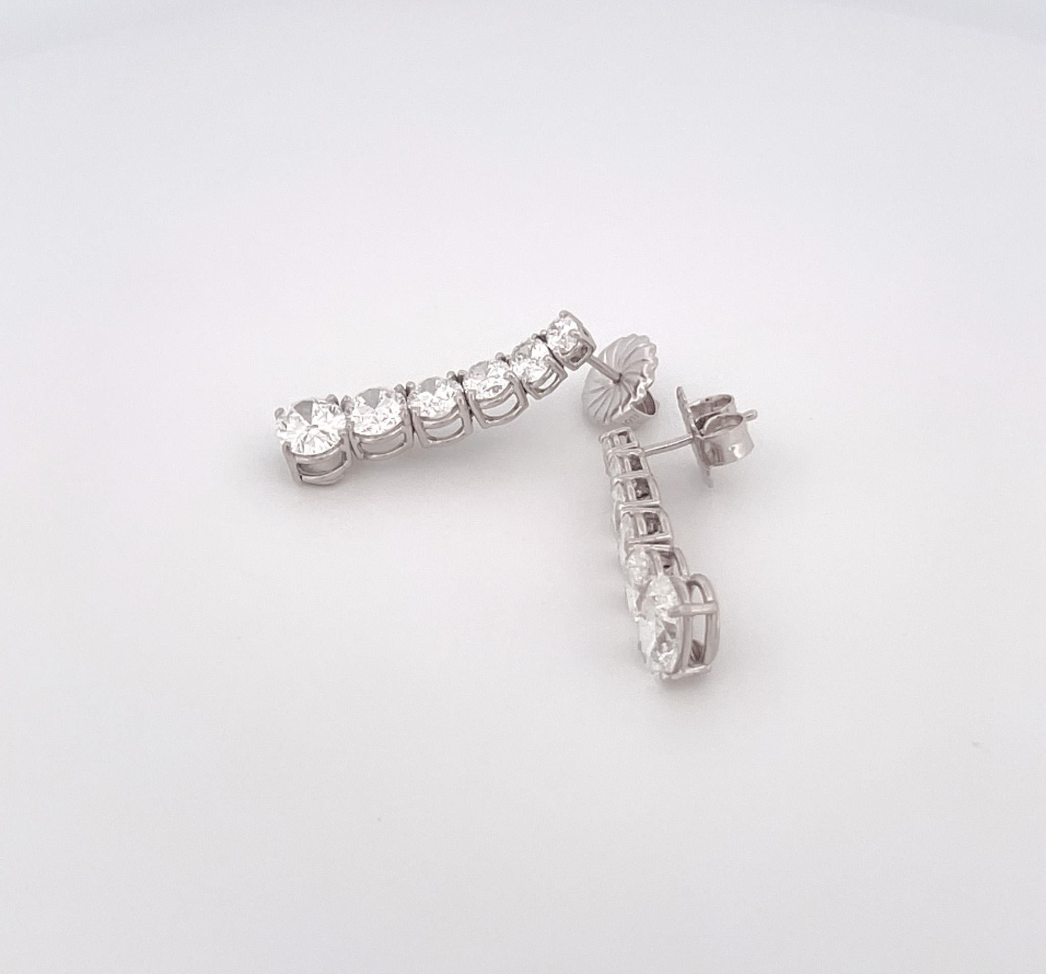 Modern Estate Platinum Graduated Oval Diamond Drop Earrings For Sale
