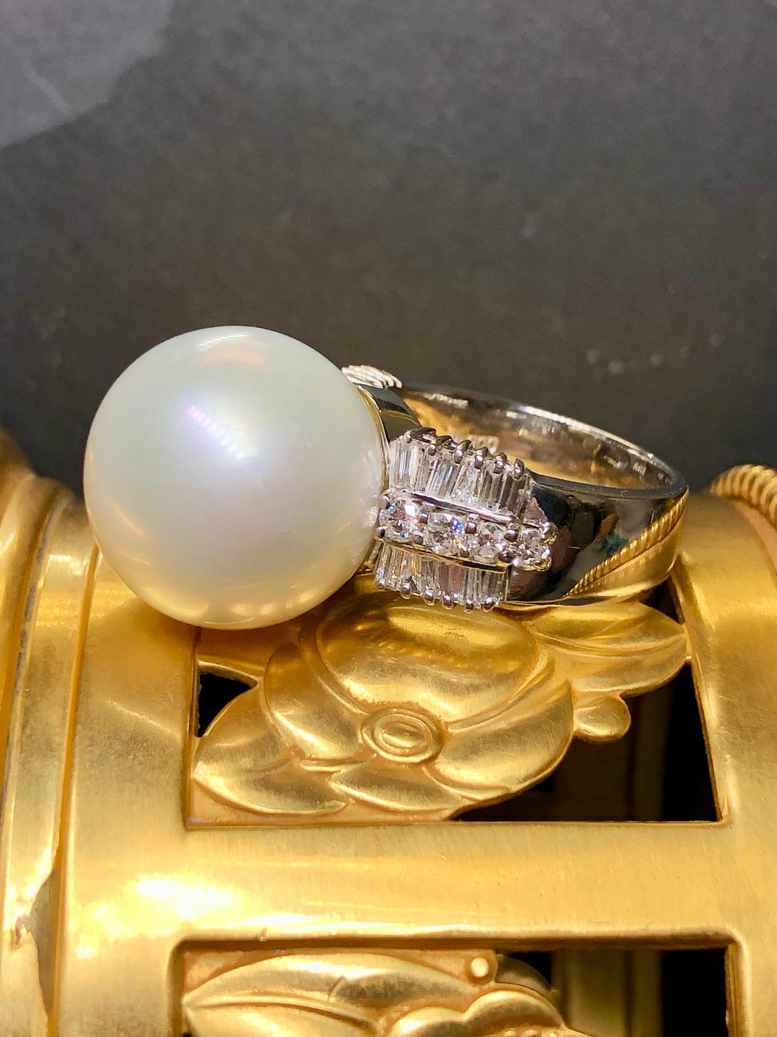 A showstopper of a pearl ring and a rarity at this size. This incredible cocktail ring is crafted in platinum and centered by a 17.30mm South Sea pearl with gorgeous luster and no pitting or blemishes which alone is a rarity. Flanking the central