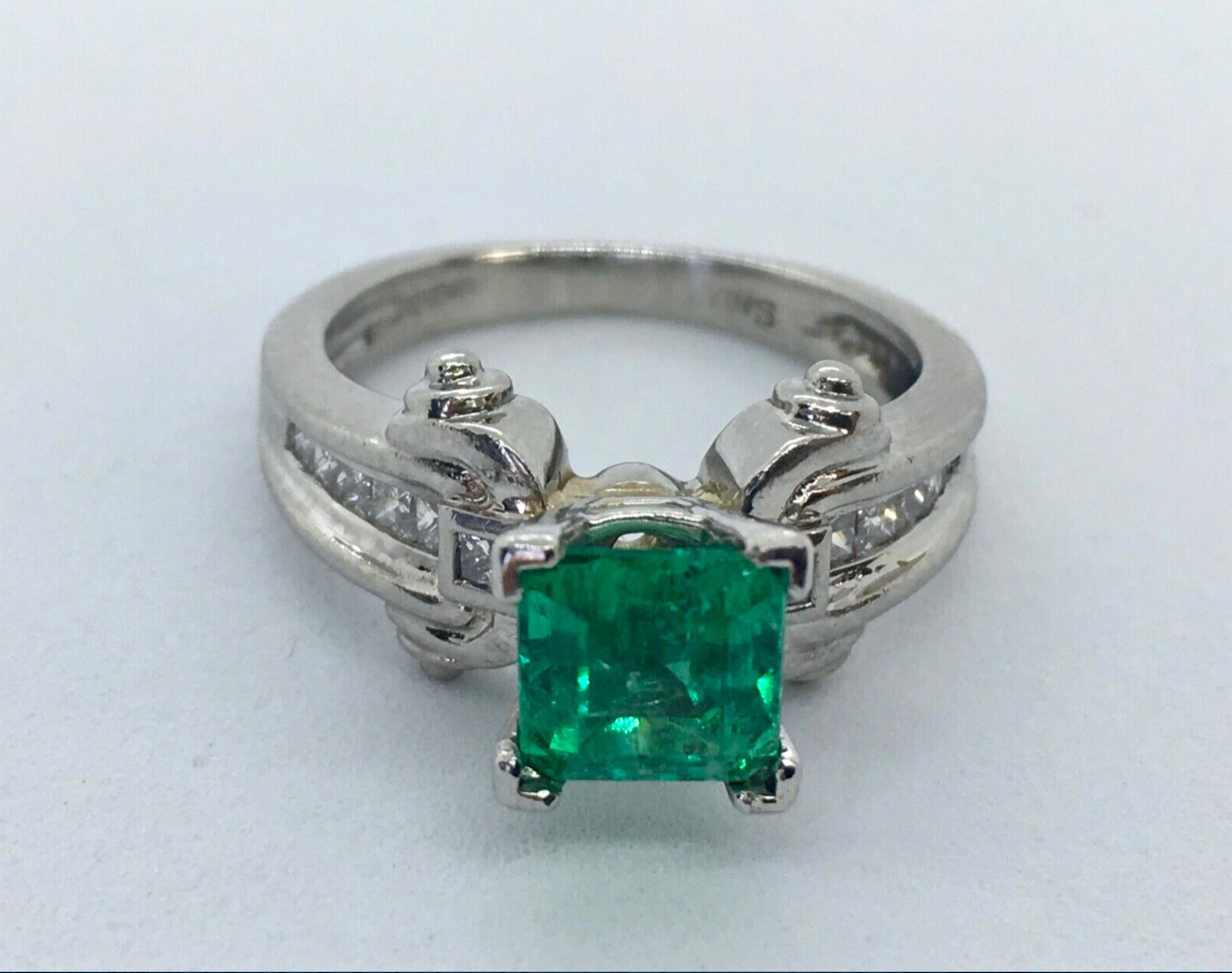 Mounting Is Custom Made of Solid Platinum Center Fine Natural Colombian Emerald 1.85 Carat Vivid Medium Green
Side: Natural  princes Cut Diamonds 0.75 Carat Clarity  VS1 Color F/G
Weight 9.5g
Ring Size 5
Excellent Condition/ Estate
