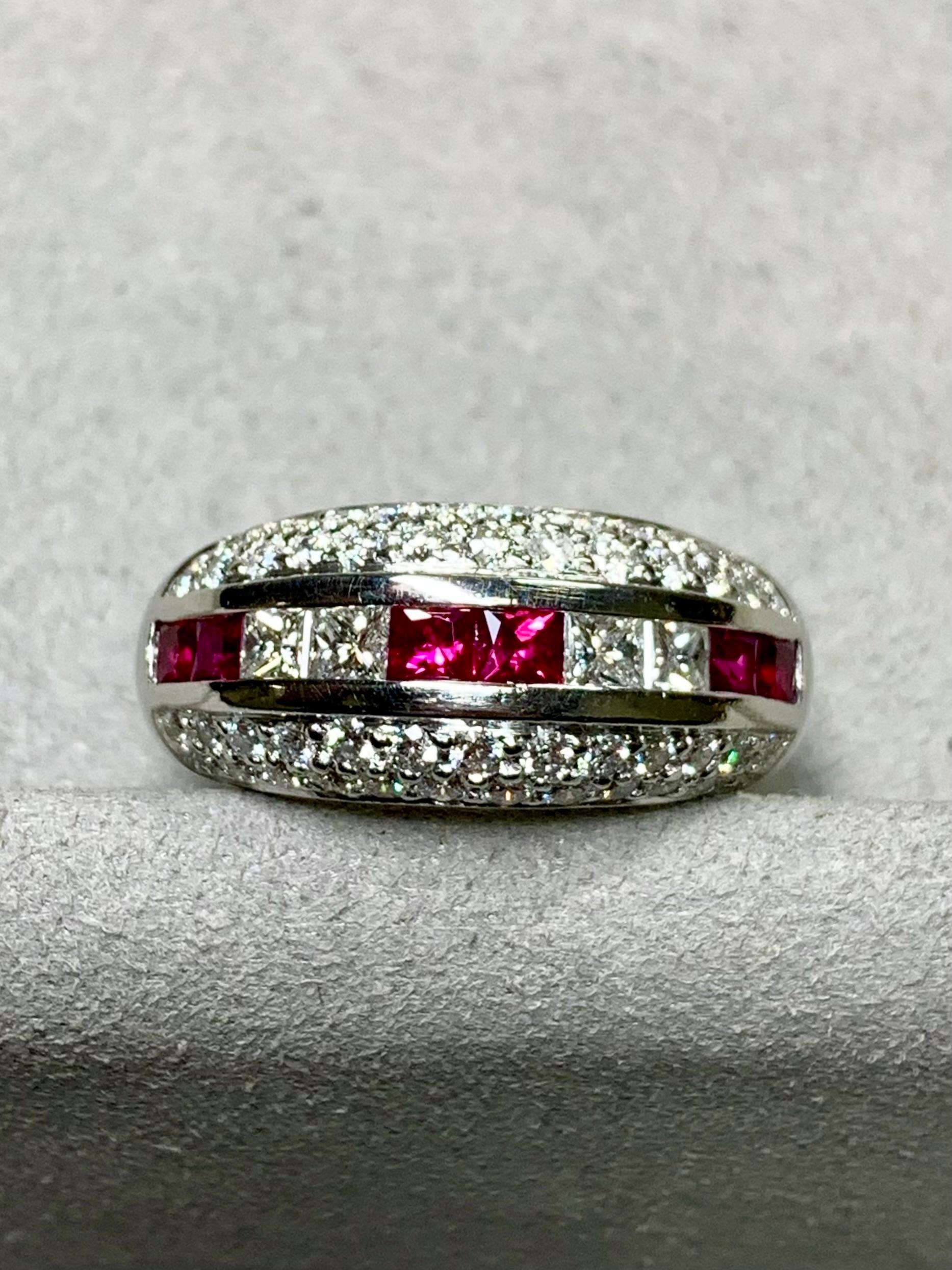 
An elegant contemporary band ring done in platinum and both pave and channel set with approximately 1.35ctw in G-I color Vs1-2 clarity round and princess cut diamonds as well as 1.20ctw in square cut natural rubies.


Dimensions/Weight:

Ring