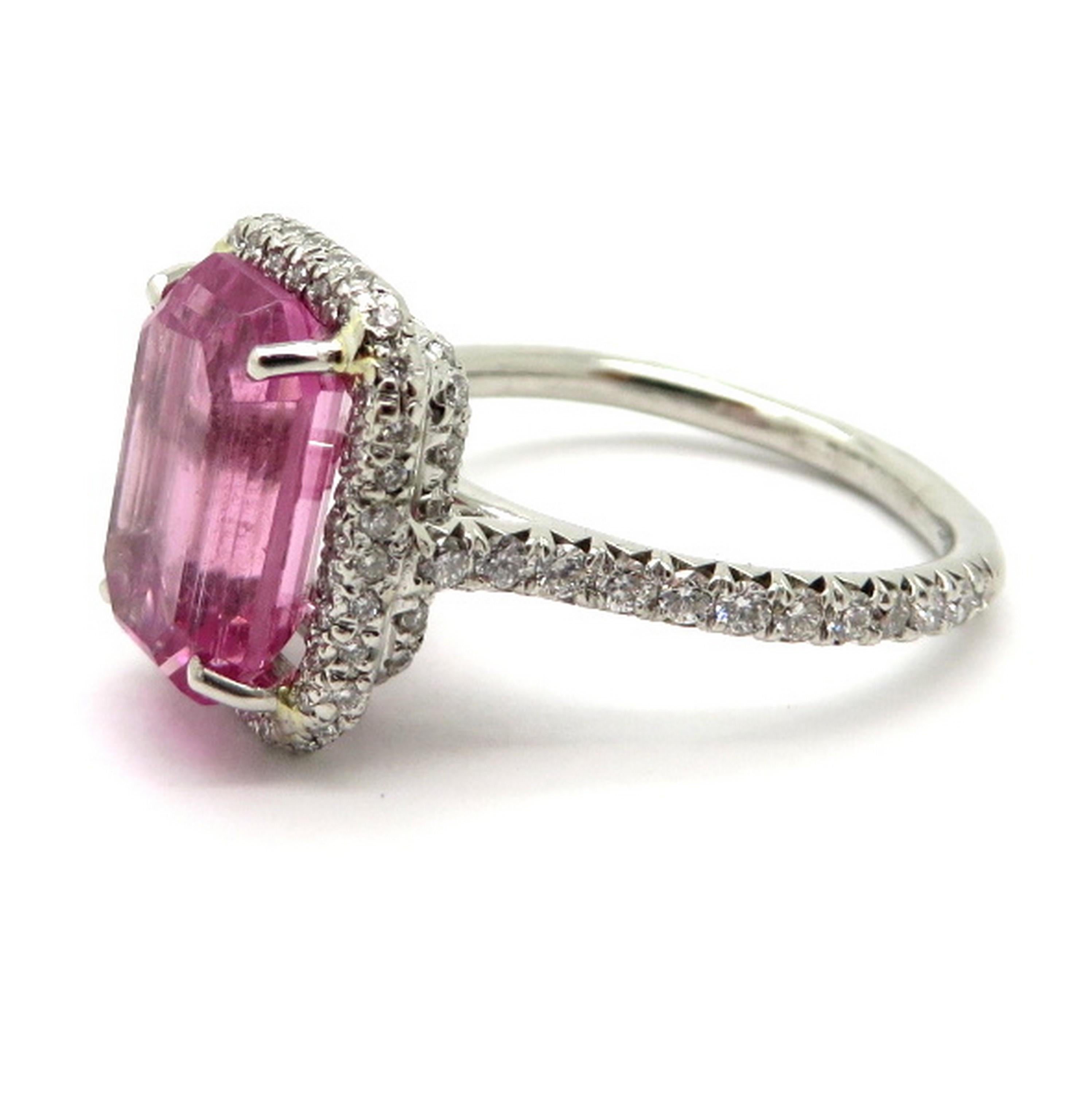 Estate platinum pink tourmaline and diamond fashion ring. Showcasing one fine quality emerald cut pink tourmaline, prong set, weighing approximately 4.26 carats. Accented with 86 round brilliant cut diamonds, bead set, weighing a combined total of