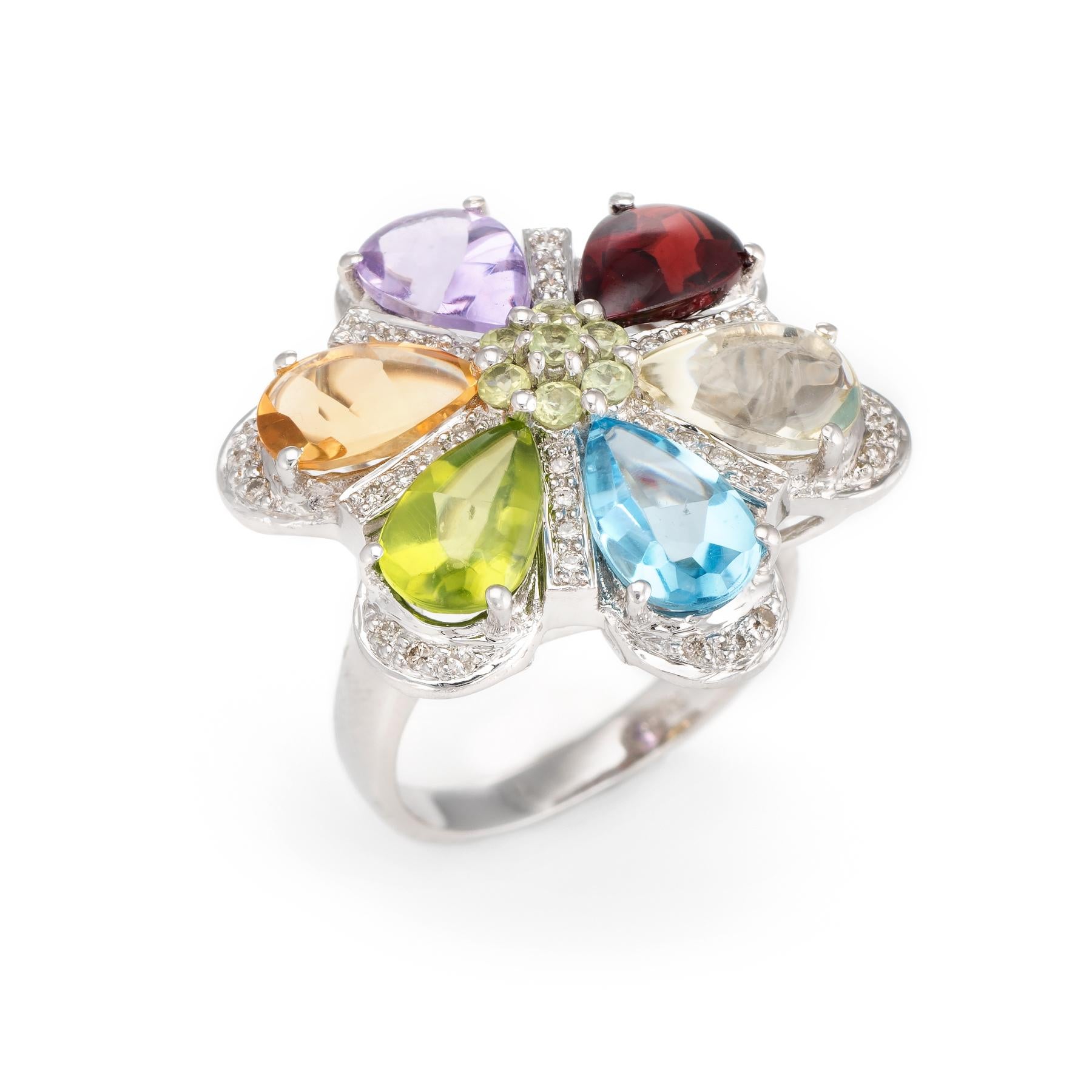 Distinct & stylish rainbow semi-precious gemstone cocktail ring, crafted in 14 karat white gold. 

Garnet, blue topaz, peridot, citrine & amethyst each measure 9mm x 6mm (estimated at 1.25 carats each). The top of each stone is cabochon cut with the