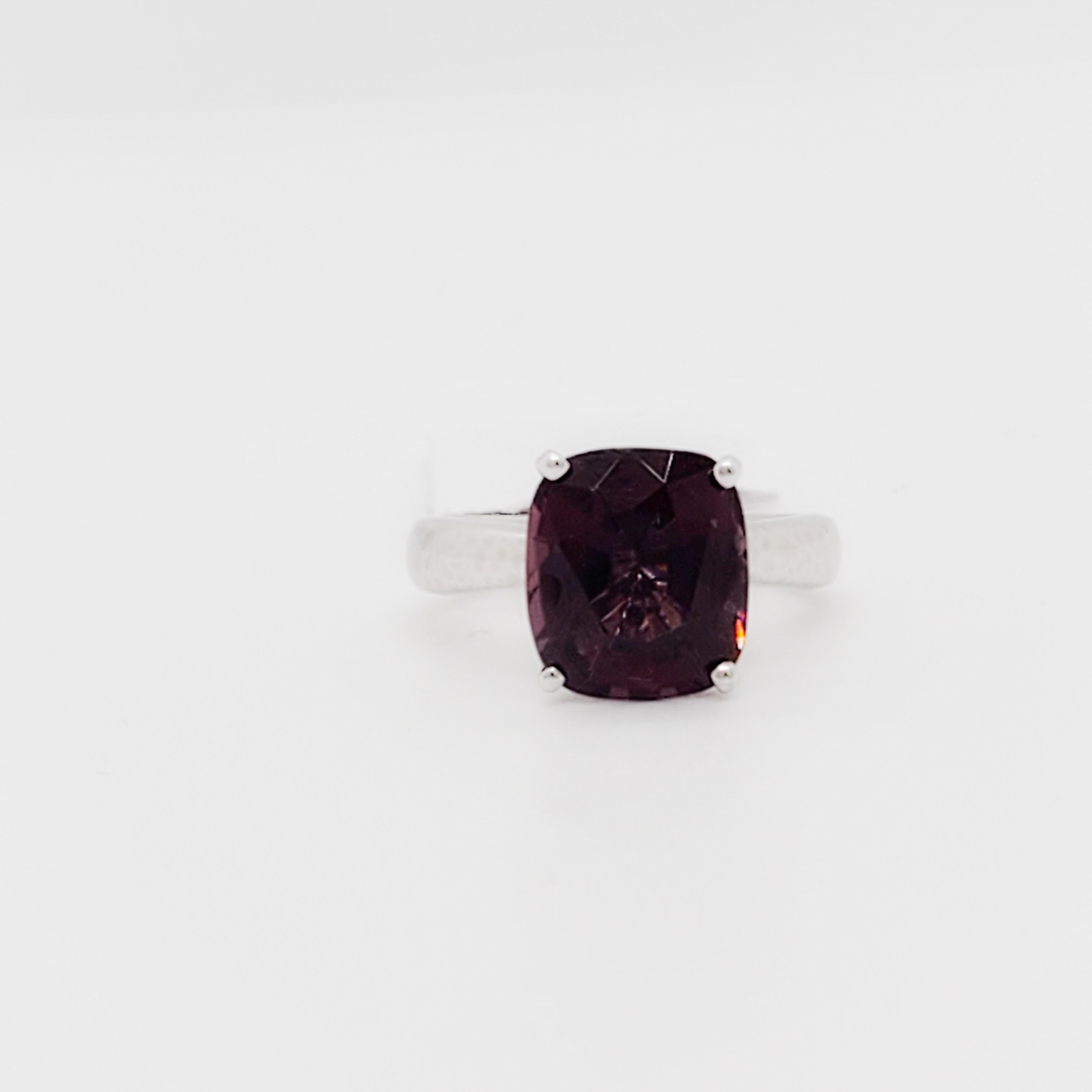 Beautiful deep red spinel cushion weighing 4.78 ct.  Handmade 14k white gold mounting.  Ring size 5.25.