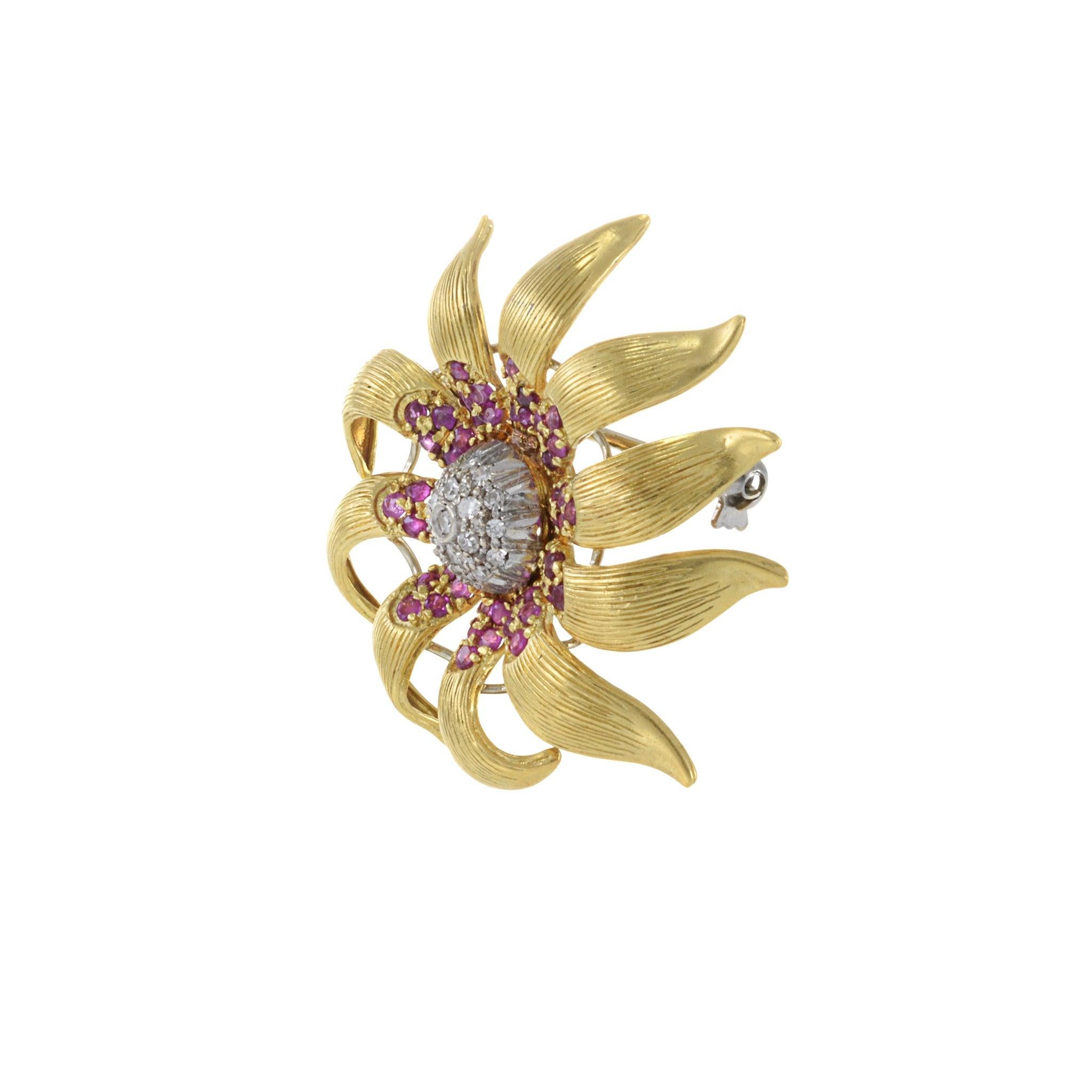 18KT yellow gold and ruby and diamond flower pin . An elegant addition to any collection, it is sure to be treasured for generations to come. 10.88 grams