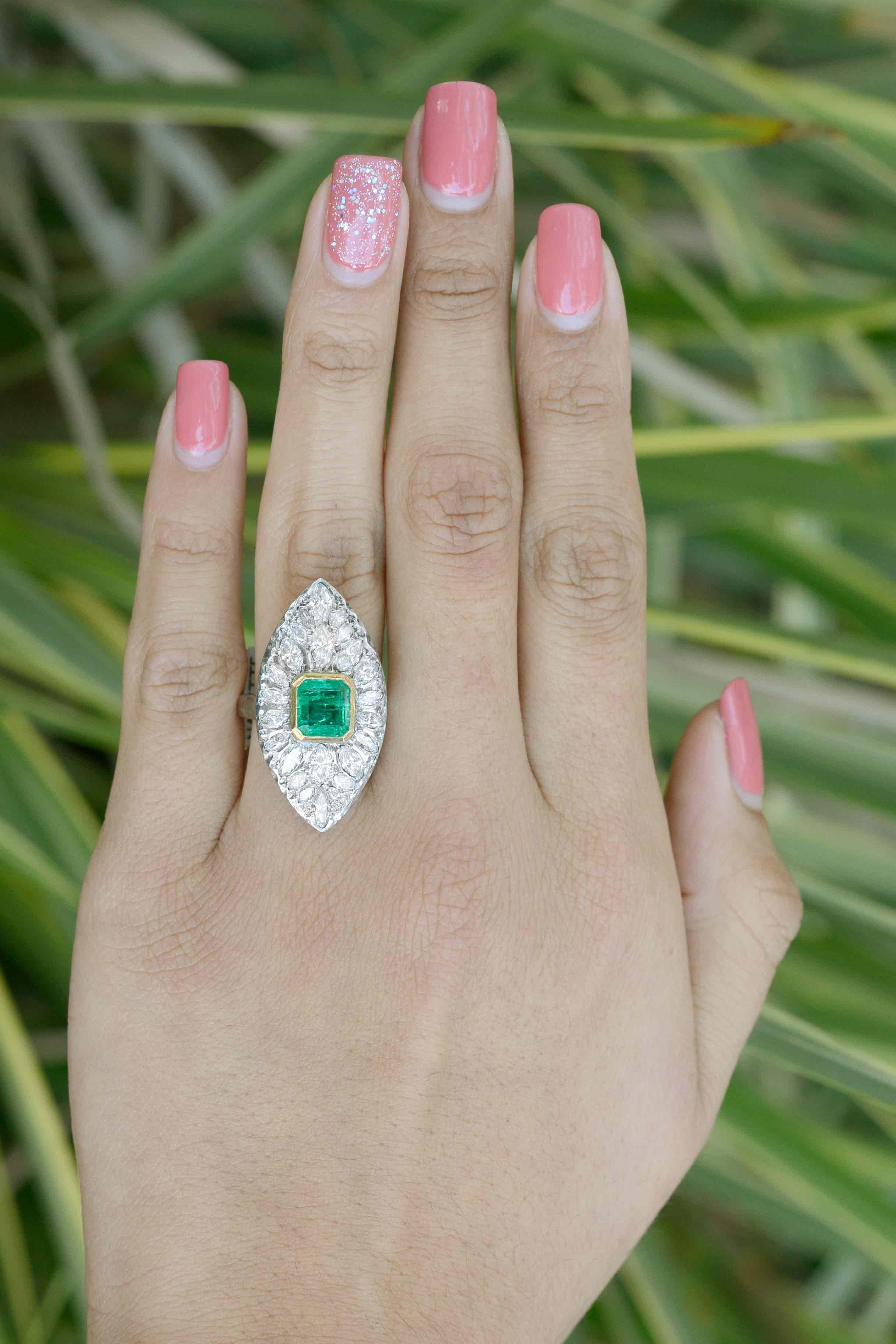 The Danville 2 carat emerald and diamond clocktail ring is a fascinating retro era estate cluster. A lush, vibrant Colombian emerald smartly set in a yellow gold bezel is surrounded by 24 marquis cut diamonds with breathtaking scintillation owing to
