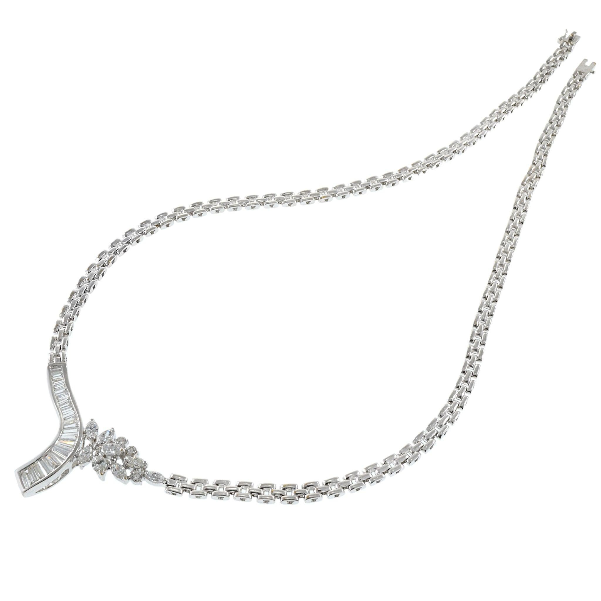 This exquisite estate necklace features a stunning array of diamonds, including baguette, round, and marquise cuts. Crafted in 14KT white gold, the necklace contains a total of 3.76 carats of diamonds with F-H color and VS/SI clarity. This luxurious