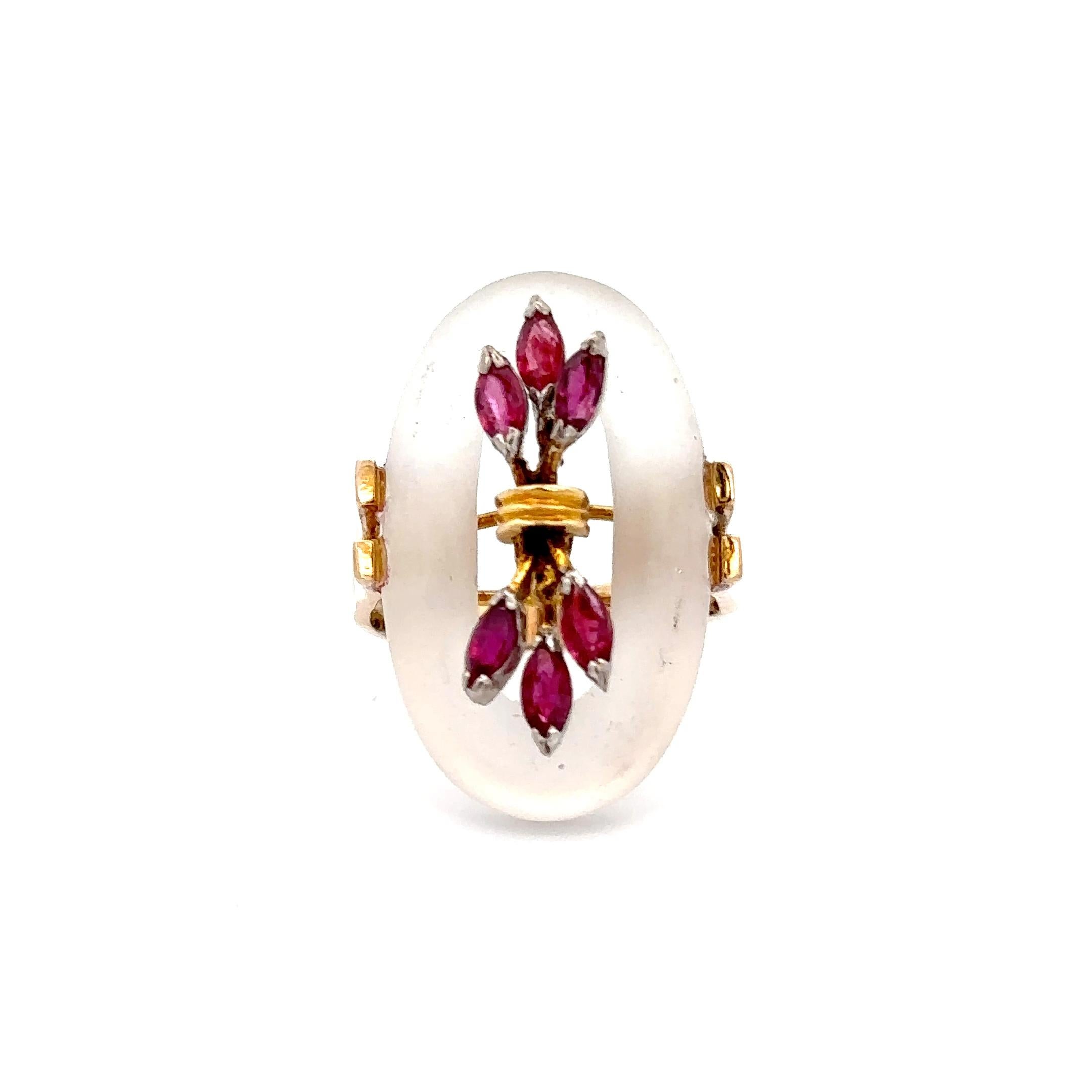 Estate retro era ring set in 18KT yellow gold oval quartz with bouquet of marquise cut rubies. A timeless classic set to last for generations. The 18KT yellow gold is the perfect compliment to the velvety marquise cut rubies and oval quartz for a