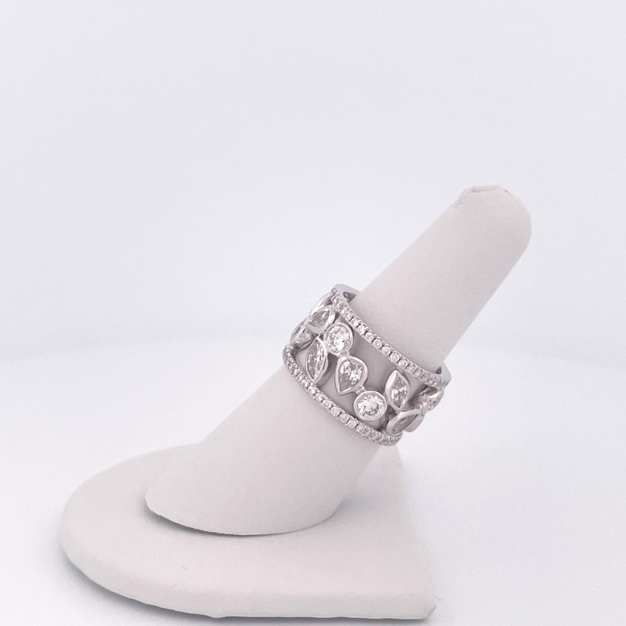 From designer Roberto Coin’s Cento Dolce Collection, 18 karat white gold diamond wide band. This band is crafted with an assortment of round brilliant cut, marquise shape, pear shape, and round cut diamonds with a total combined weight of 4.22