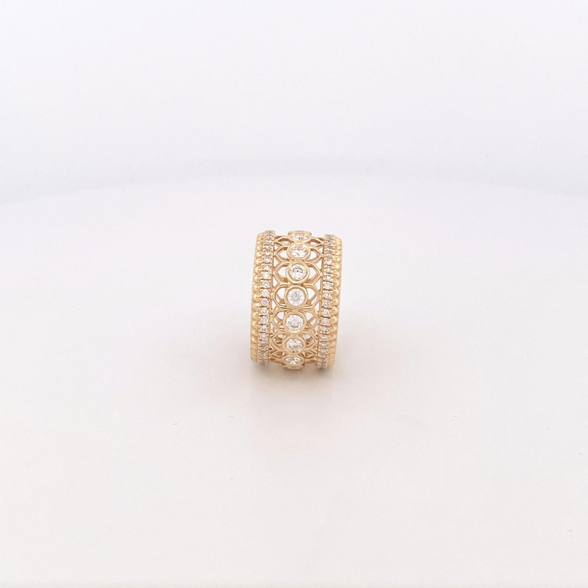 From designer Roberto Coin’s Cento Rosette Collection, 18 karat yellow gold wide diamond band. This band is crafted with round brilliant cut and round cut diamonds with a total combined weight of 1.80 carats. These diamonds have G color and VS