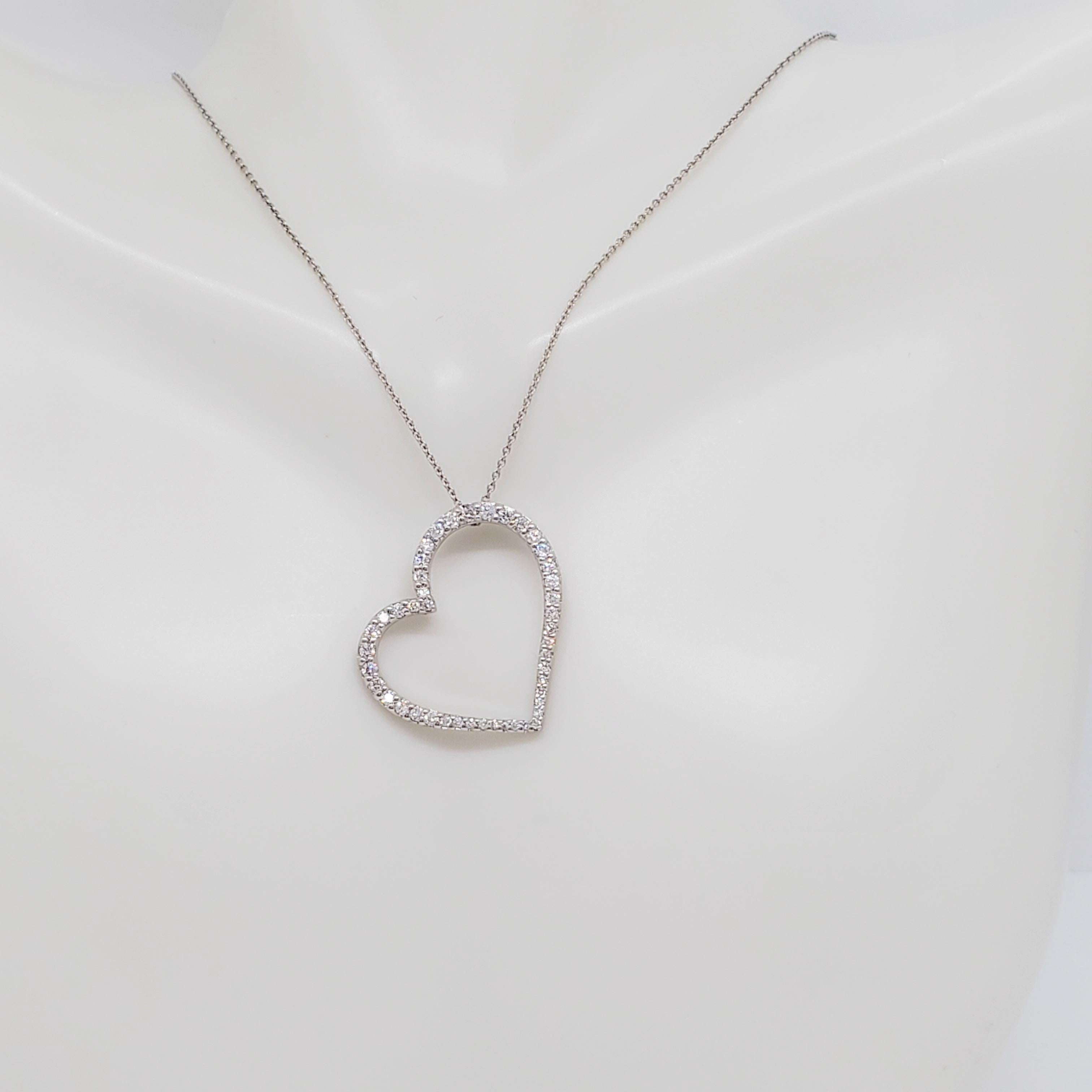 Beautiful Roberto Coin slanted open heart pendant with 0.20 ct. of good quality white diamond rounds.  Handmade in 18k white gold.  Length is 18