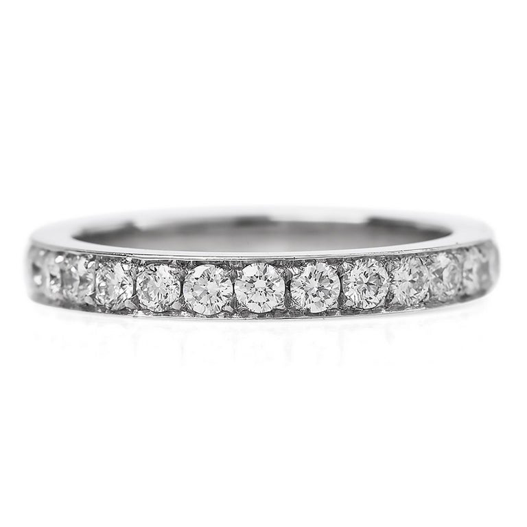 An Eternity wedding band ring with a sparkly glistening look.

This classic band is crafted in solid Platinum, weighing approximately 5.5 grams.

It features (28) Genuine dazzlings Diamonds round-cut, pave-set, weighing collectively 1.75 carats (