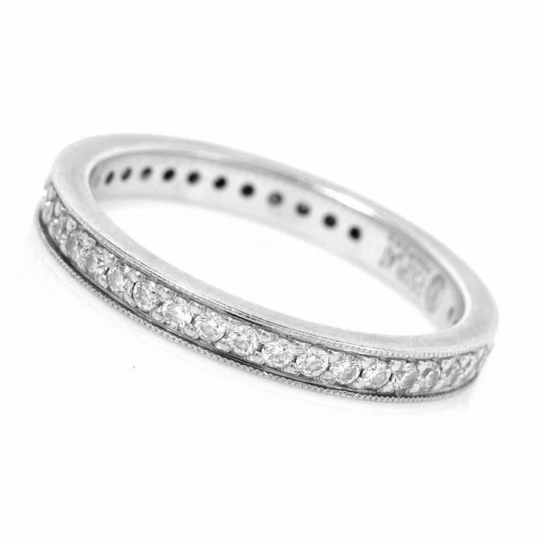 This estate eternity band is crafted in solid platinum. it is adorned with some 40 genuine round brillian cut pave-set diamonds, cumulatively weighing 0.50 cts, graded H-I color and VS1-VS2 clarity. This alluring eternity band remains in excellent