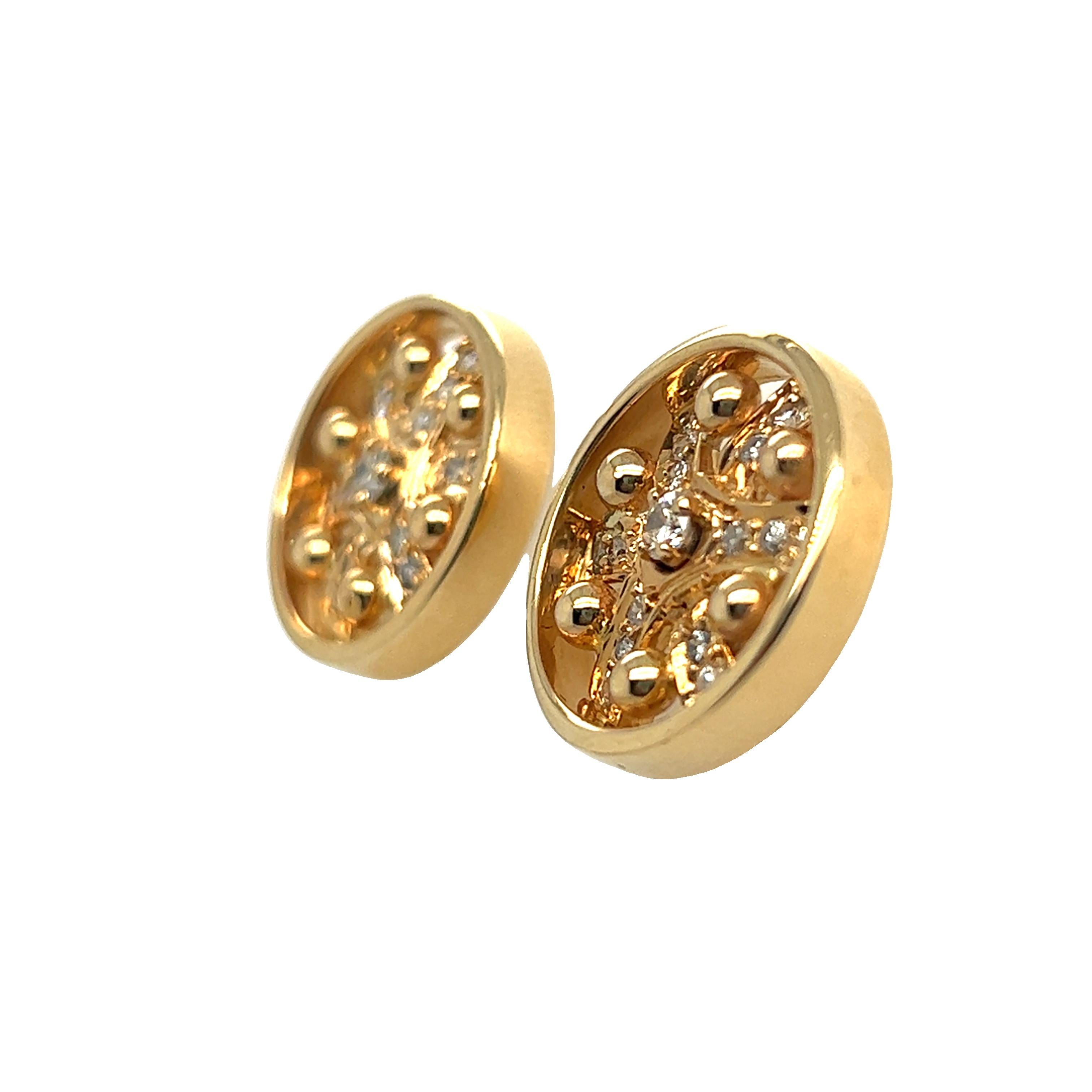 Bold and unique 14k yellow disc stud earrings. Inside the disc frame showcases gold beads and sixteen diamonds on each earrings. The total weight of these diamonds is about 1 carat with H-I color and SI2 clarity. The earrings are pierced with post