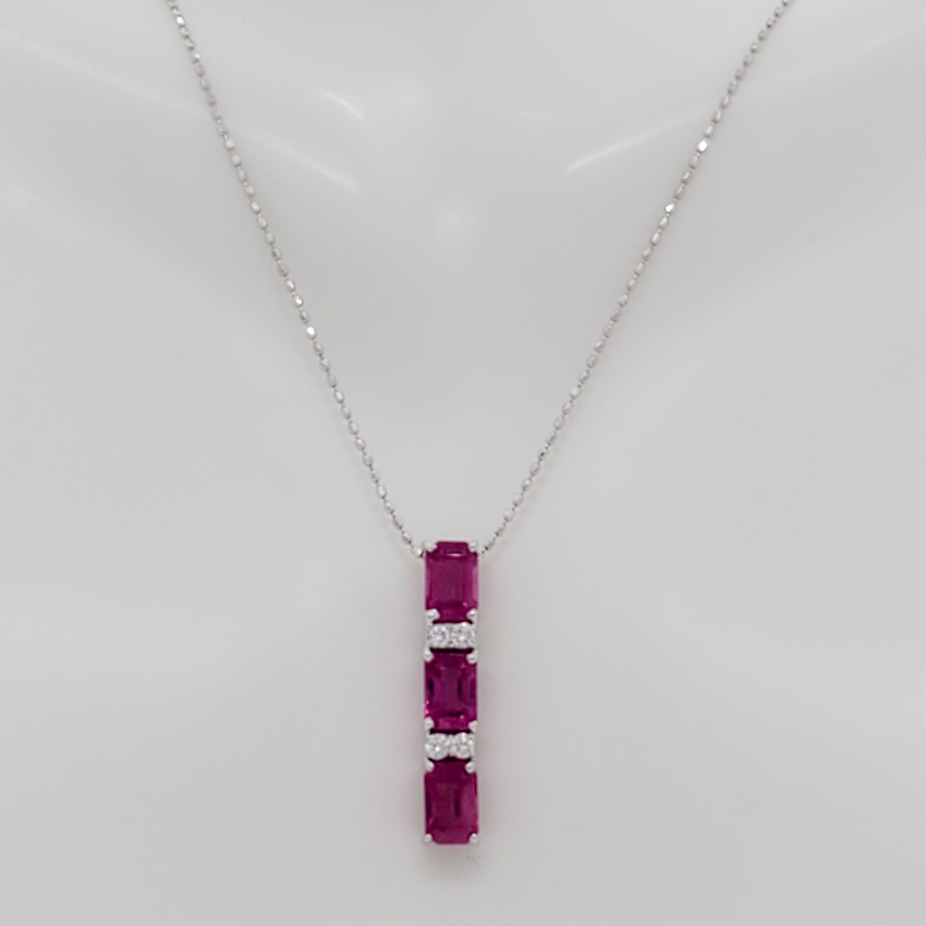 Gorgeous deep red ruby emerald cuts weighing 2.08 ct. with 0.08 ct. good quality, white, and bright diamond rounds.  Handmade in 18k white gold.  Length is 18