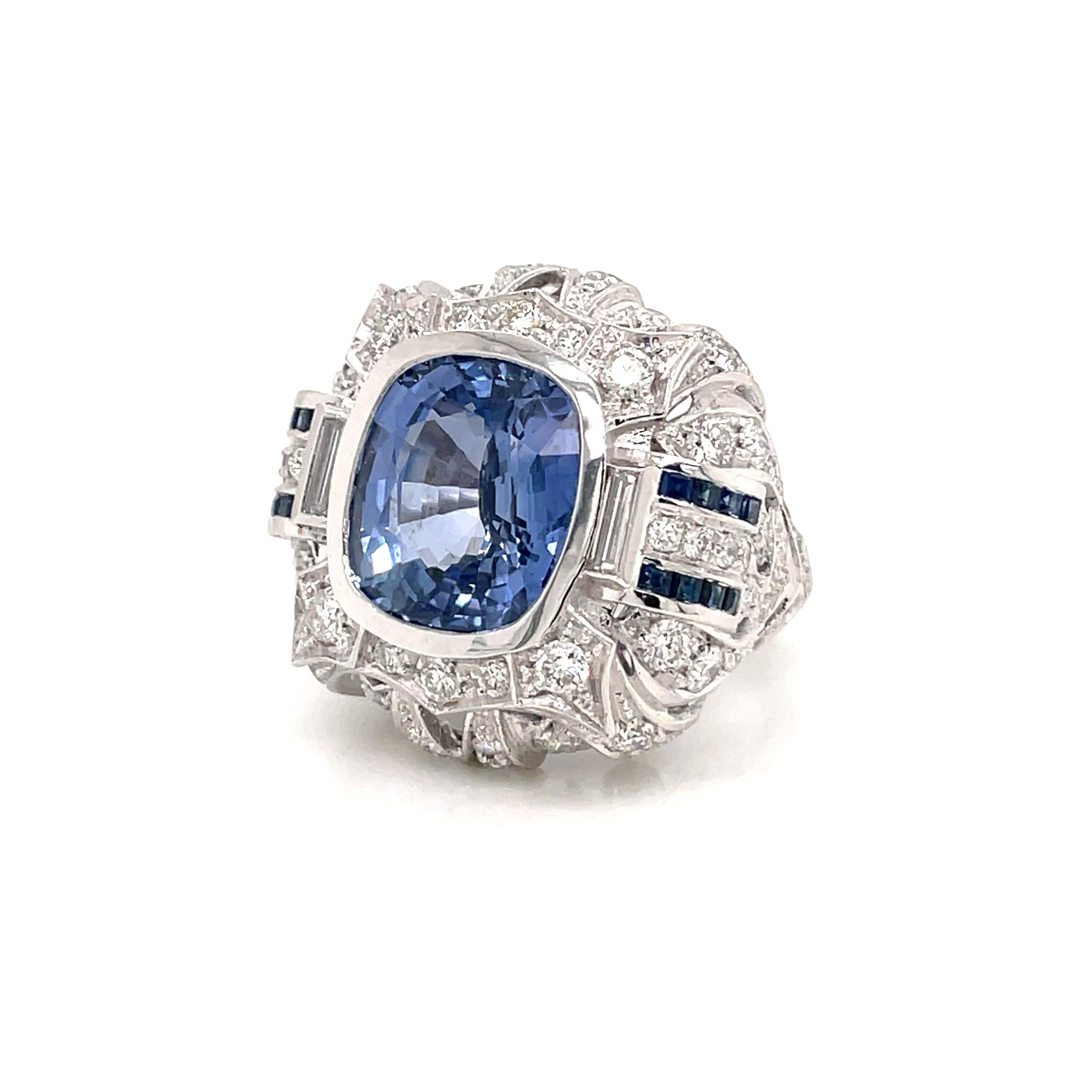 An exquisite filigree ring handcrafted in solid 18k white gold by master jewelers, featuring an amazing vivid 12,24 carat Ceylon Sapphire cushion-shape, surrounded by 4,50 carats of old cut diamonds colorless and custom cut sapphire.

The ring is