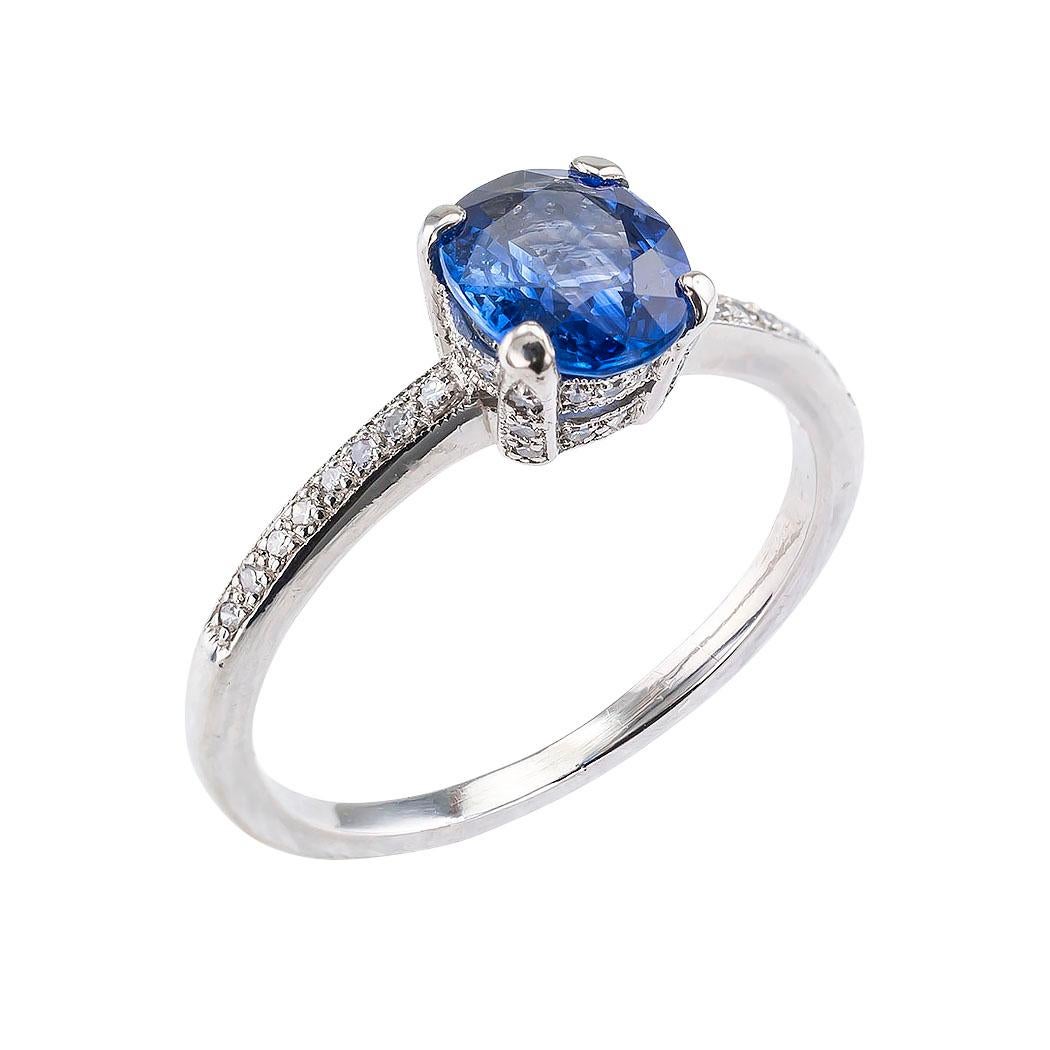 Estate sapphire diamond and platinum solitaire engagement ring.

DETAILS:
GEMSTONES:  one oval blue sapphire weighing approximately 1.04 carats.
DIAMONDS:  forty-four single-cut diamonds totaling approximately 0.15 carat, approximately H color, SI