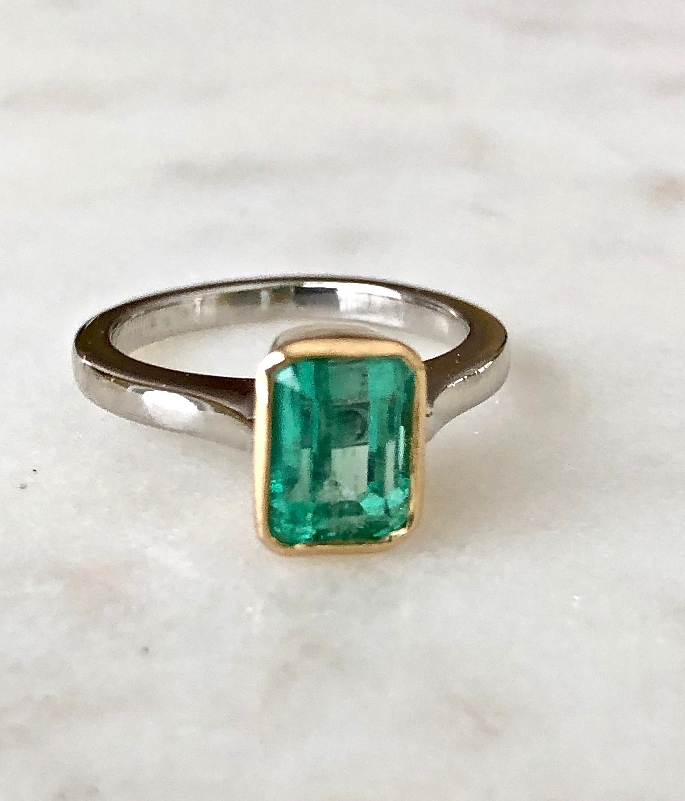 Emerald Cut Estate Solitaire Emerald 18 Karat Platinum Engagement Ring