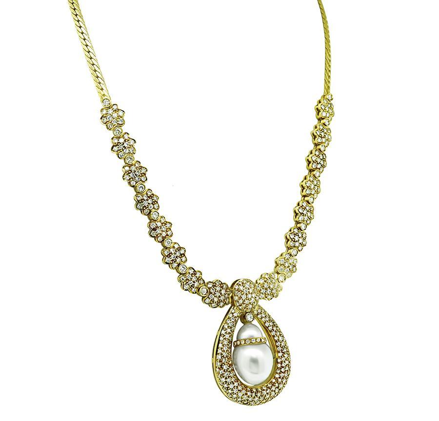 This is a fabulous 18k yellow gold necklace. The necklace features lovely south sea pearls. The pearls are accentuated by sparkling round cut diamonds that weigh approximately 10.00ct. The color of the diamonds is G-h with VS clarity. The necklace