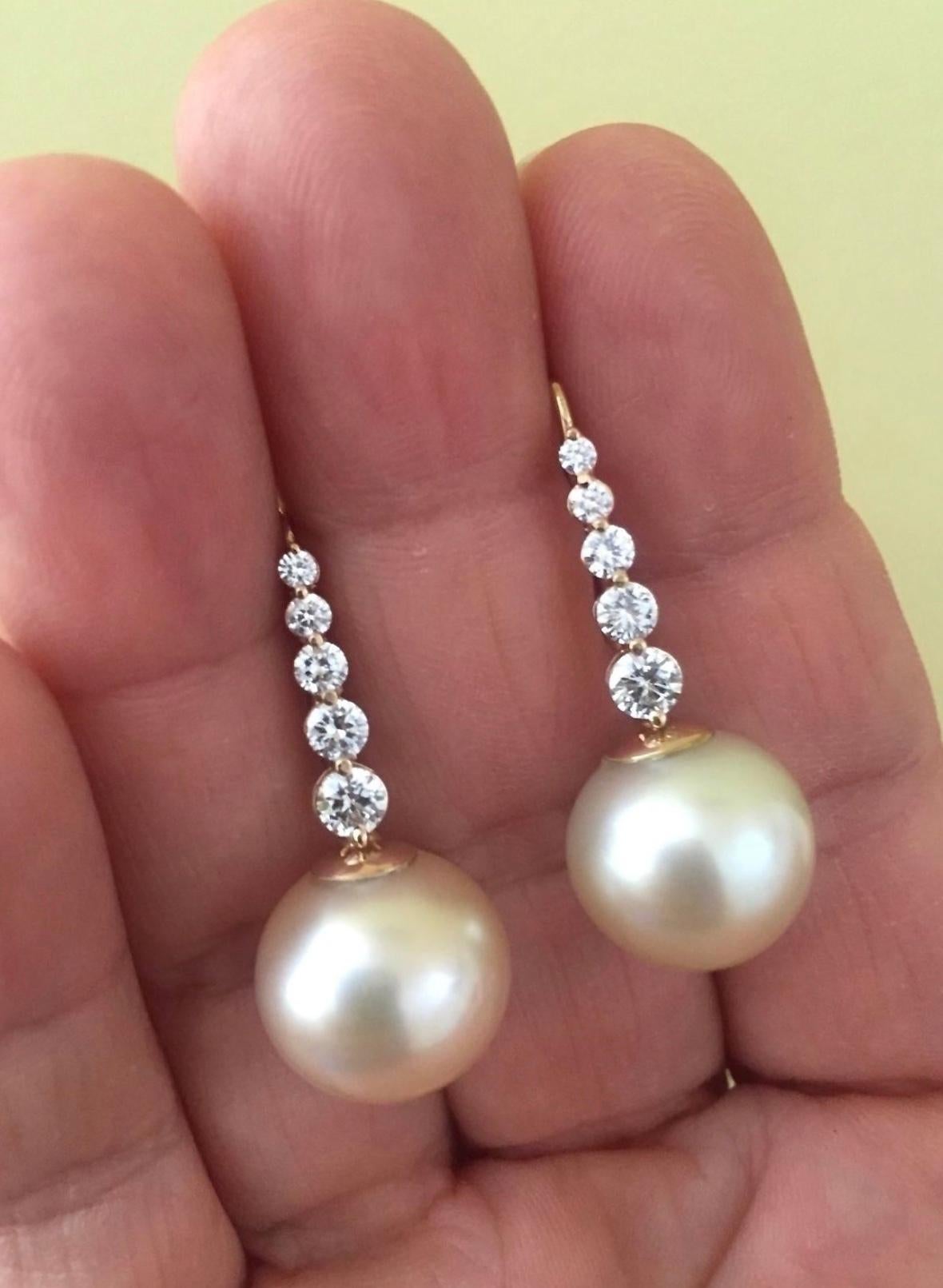 These Beautiful Estate Cultivate Natural South Sea Pearls Diamond Earrings Feature:
South Sea Pearl Shape : Almost Round
Average Color/Surface : Light Golden-Cream/ Some Natural Flaws(see photos)
Nacre: Thick
Pearl Measurements : Approx. 14.5mm x