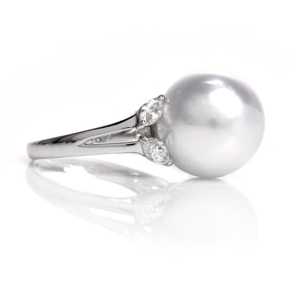 This exquisite cocktail ring with an outstanding, highly lustrous 13mm South Sea Pearl of an enchanting white with a subtle nuance of cream color and marquise diamonds is crafted in solid platinum and weighs 8.3 gram. This cocktail ring exposes a