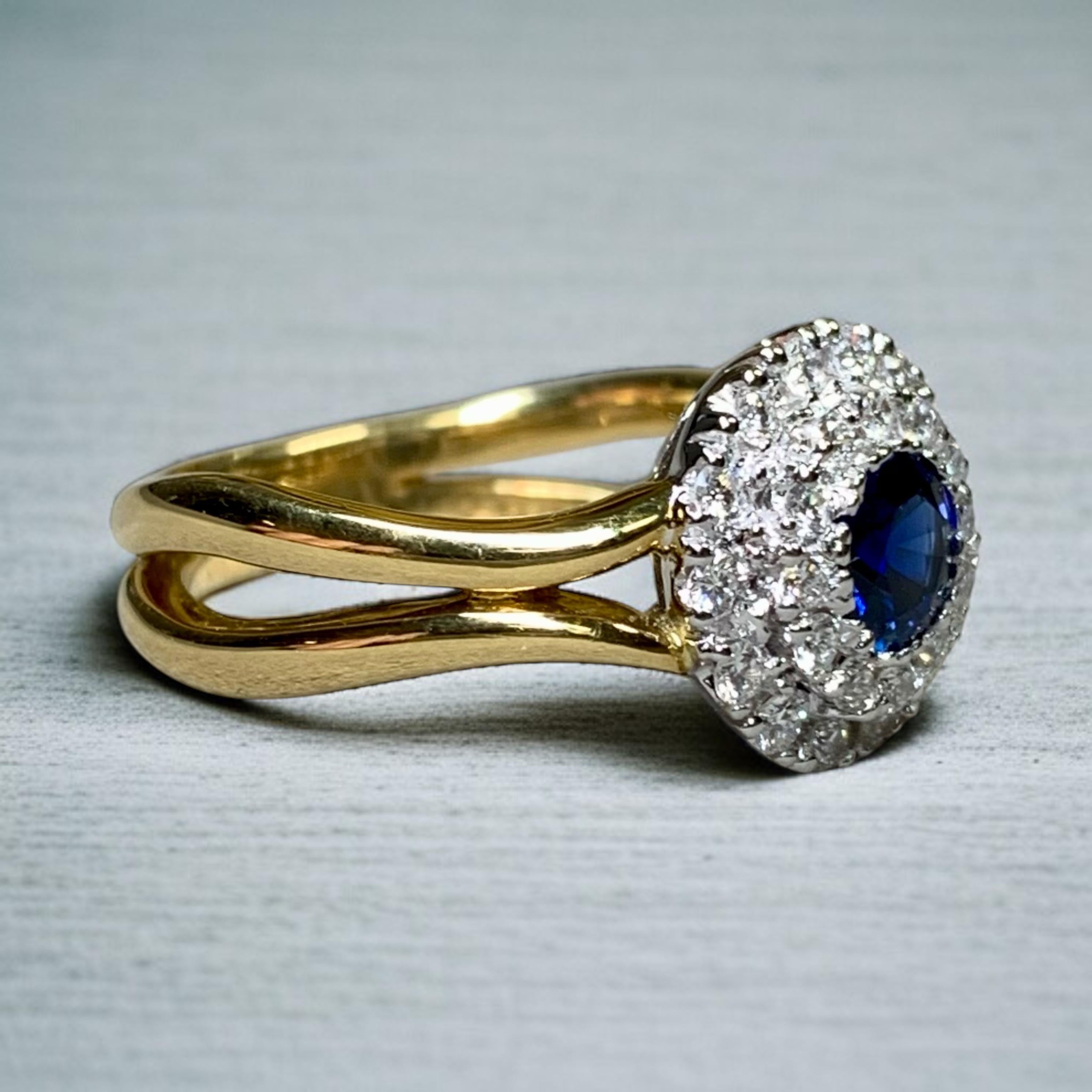 
A finely made ring by SPARK hand crafted in 18K yellow gold with a European style split shank and centered but a white gold halo. The centerpiece of this ring is a .57ct natural blue sapphire surrounded by perfectly matched ideal cut round diamonds