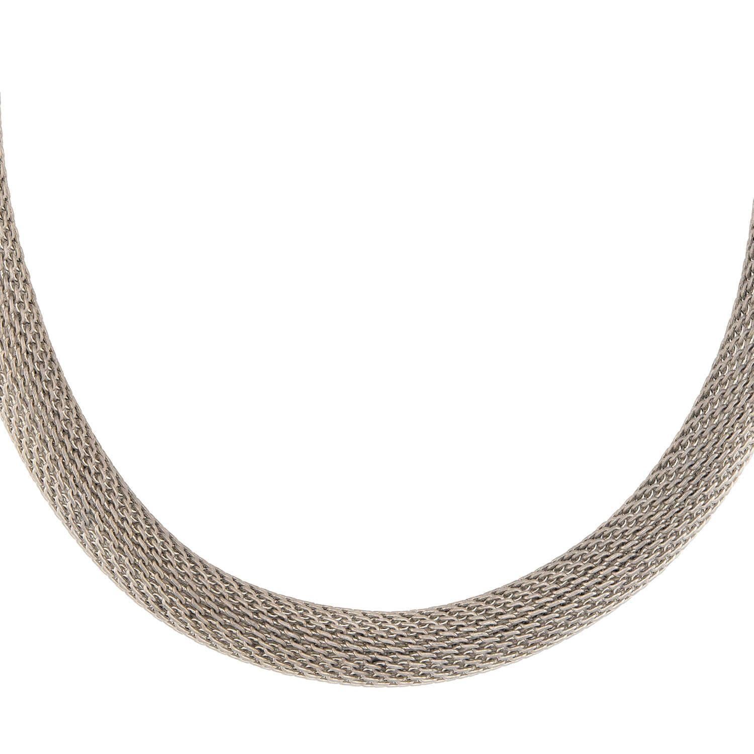 A fantastic mixed metals choker necklace! Crafted in sterling silver this necklace is comprised of interlocking ellipse-shaped links, which form a three-dimensional mesh choker necklace. The piece has wonderful fluidity, and is comfortable on. The