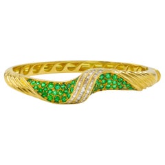 Estate Swirling 18 Karat Yellow Gold, Emerald and Diamond Bracelet