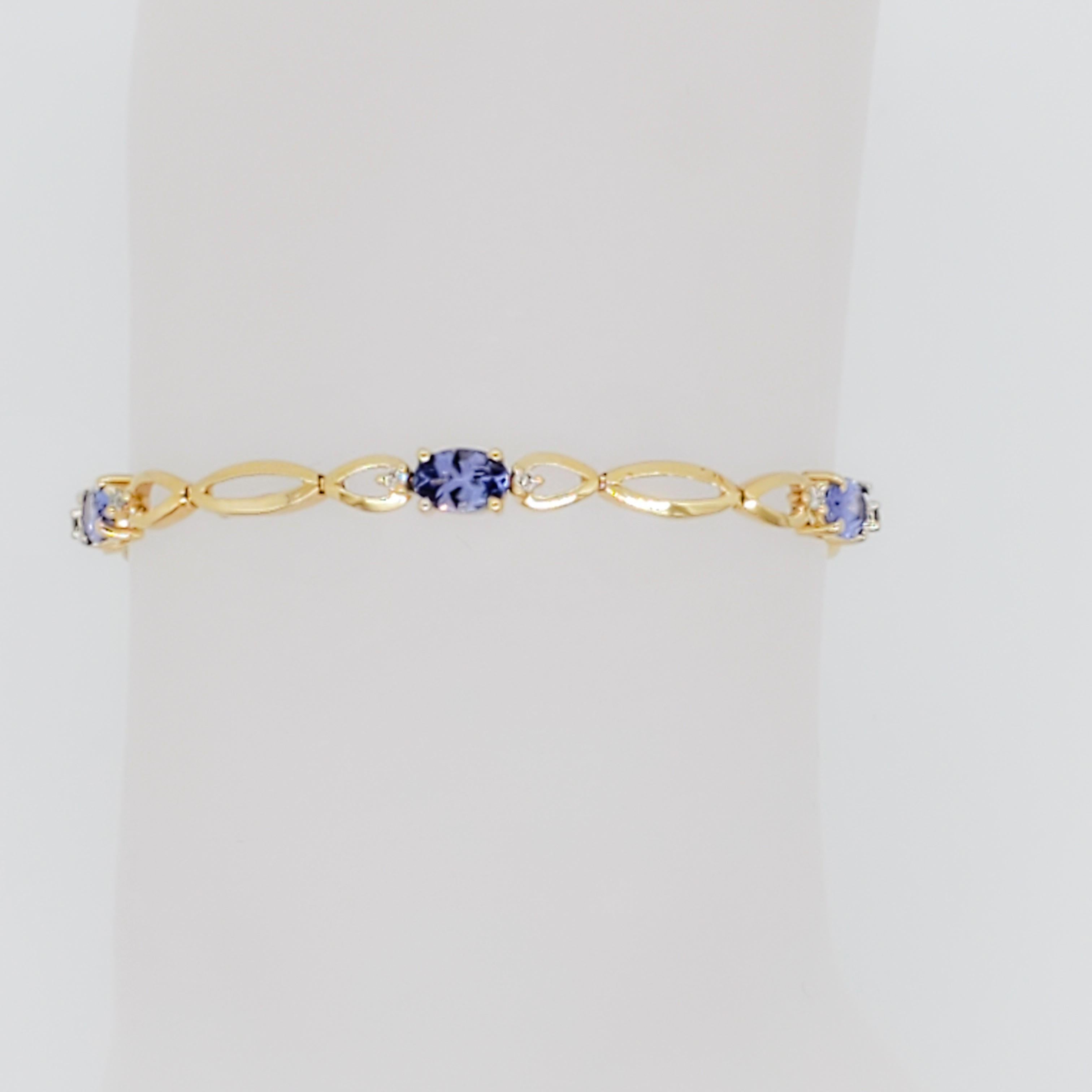 Gorgeous bracelet with 3.15 ct. tanzanite ovals and 0.17 ct. good quality white diamond rounds.  Handmade in 14k yellow gold.  Length of bracelet is 7.5