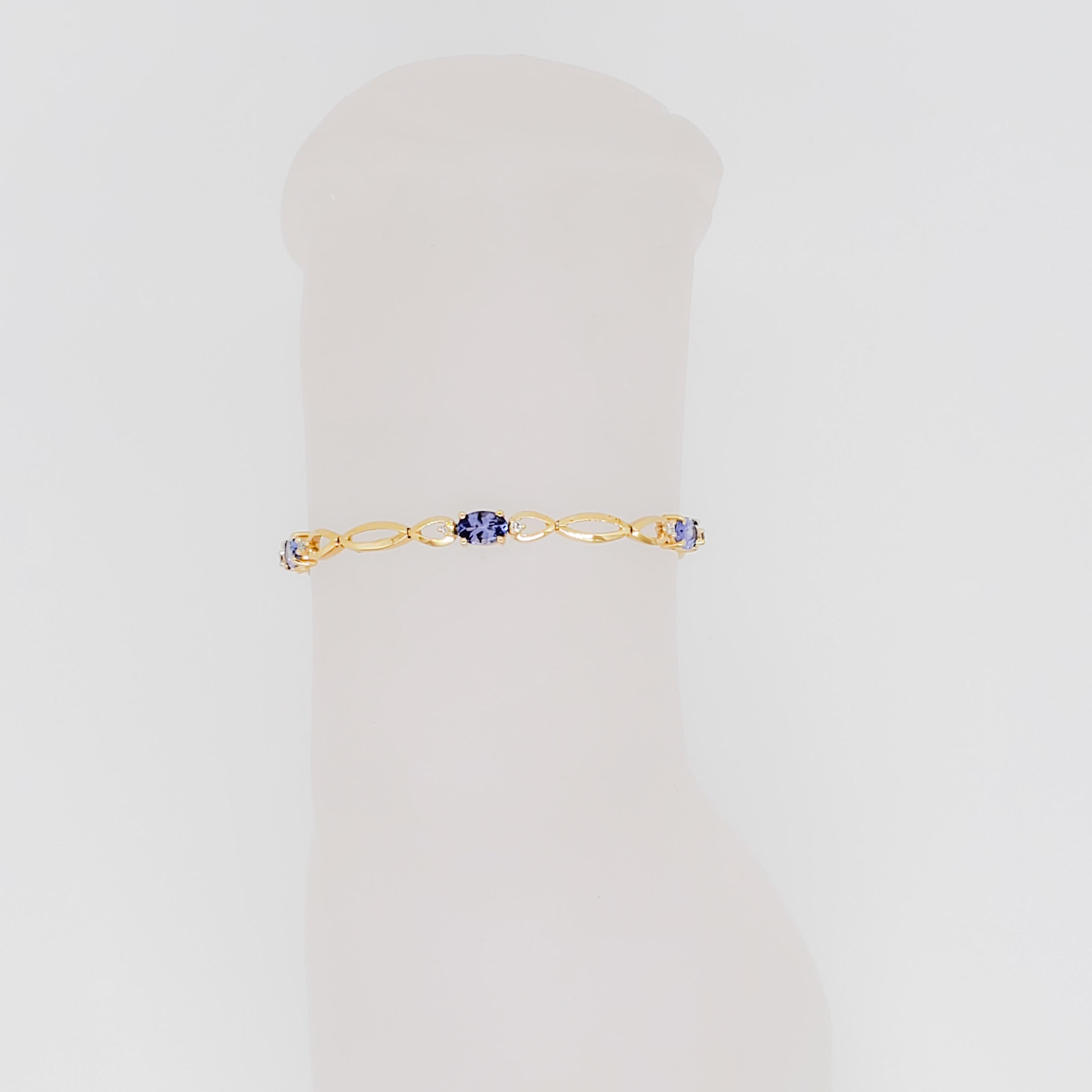 Oval Cut Tanzanite and White Diamond Bracelet in 14k Yellow Gold For Sale