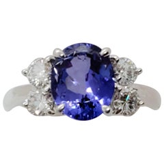 Estate Tanzanite Oval and White Diamond Ring in Platinum