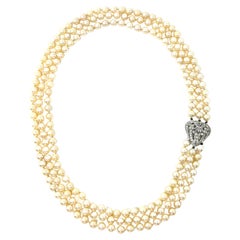 Estate Three Strand Pearl Necklace with a Platinum and Diamond Centerpiece