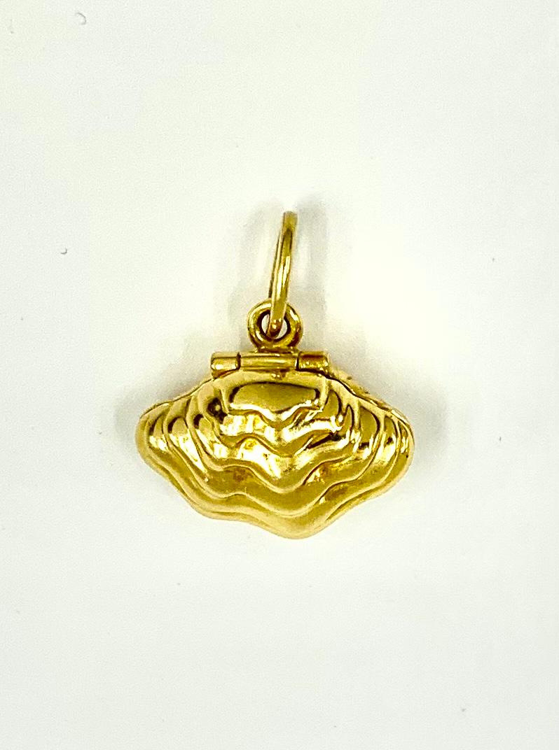 Vintage Tiffany & Co. 18K yellow gold and multi-colored enamel oyster pendant charm opening to reveal an Akoya pearl. 
Many wonderful quotes were inspired by this marvelous mollusk, as was Tiffany & Co. when they created this beautiful pendant