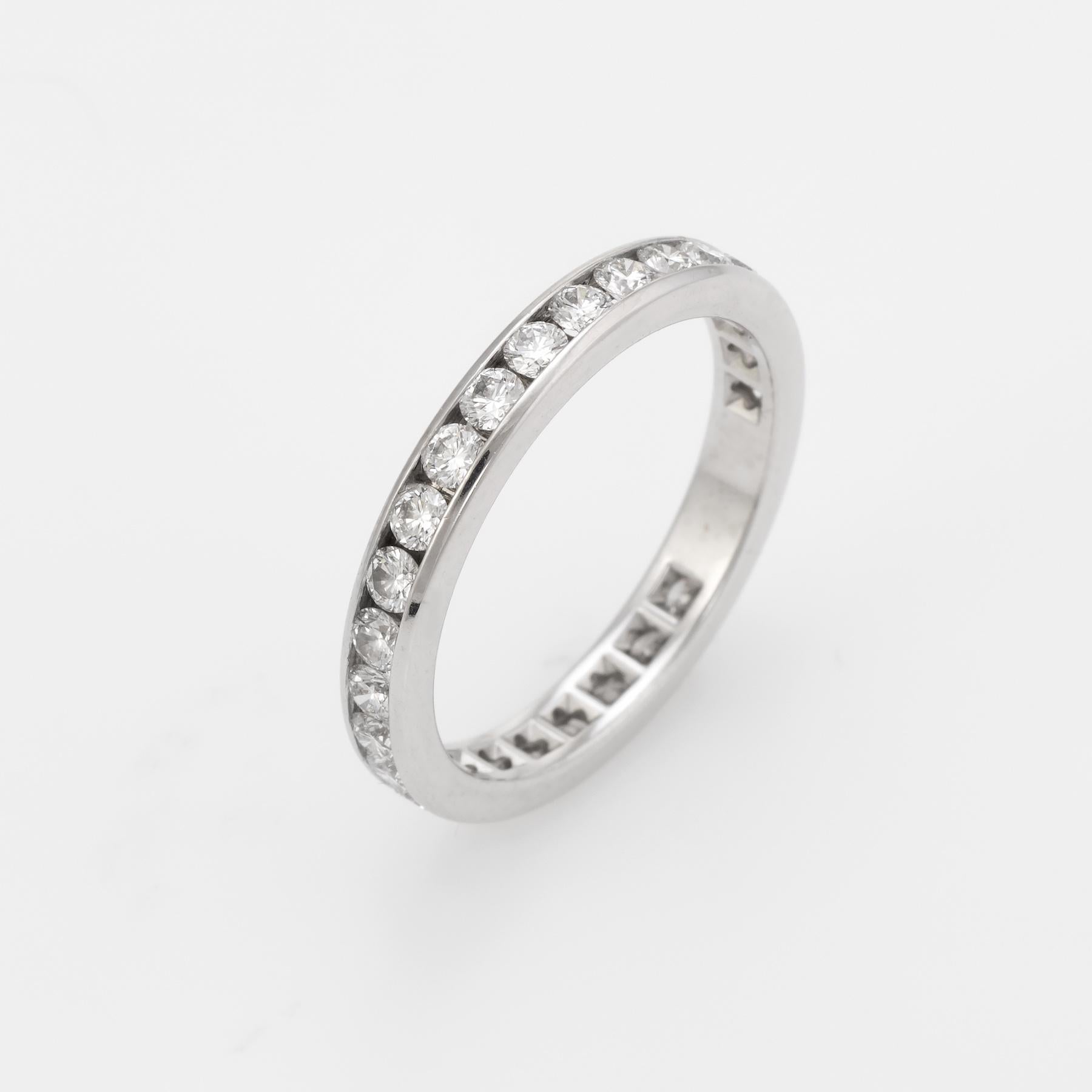 Pre owned Tiffany & Co diamond wedding band, crafted in 950 platinum.  

28 round brilliant cut diamonds are channel set into the band and total an estimated 1 carat (estimated at F-G color and VVS1 clarity).

The ring currently retails for $5,150