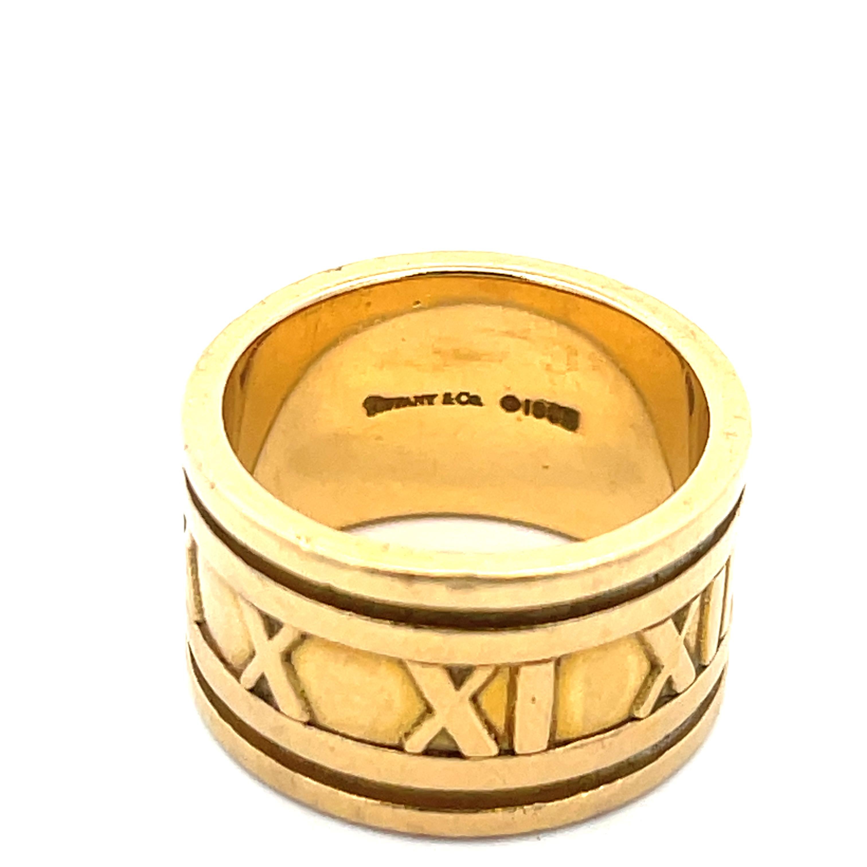 Tiffany & Co, Atlas Ring in 18K Yellow Gold. The ring is 12mm wide, rings size 6 1/2, and weighs 15 grams. Stamped Tiffany & Co 1995 7501 Italy.