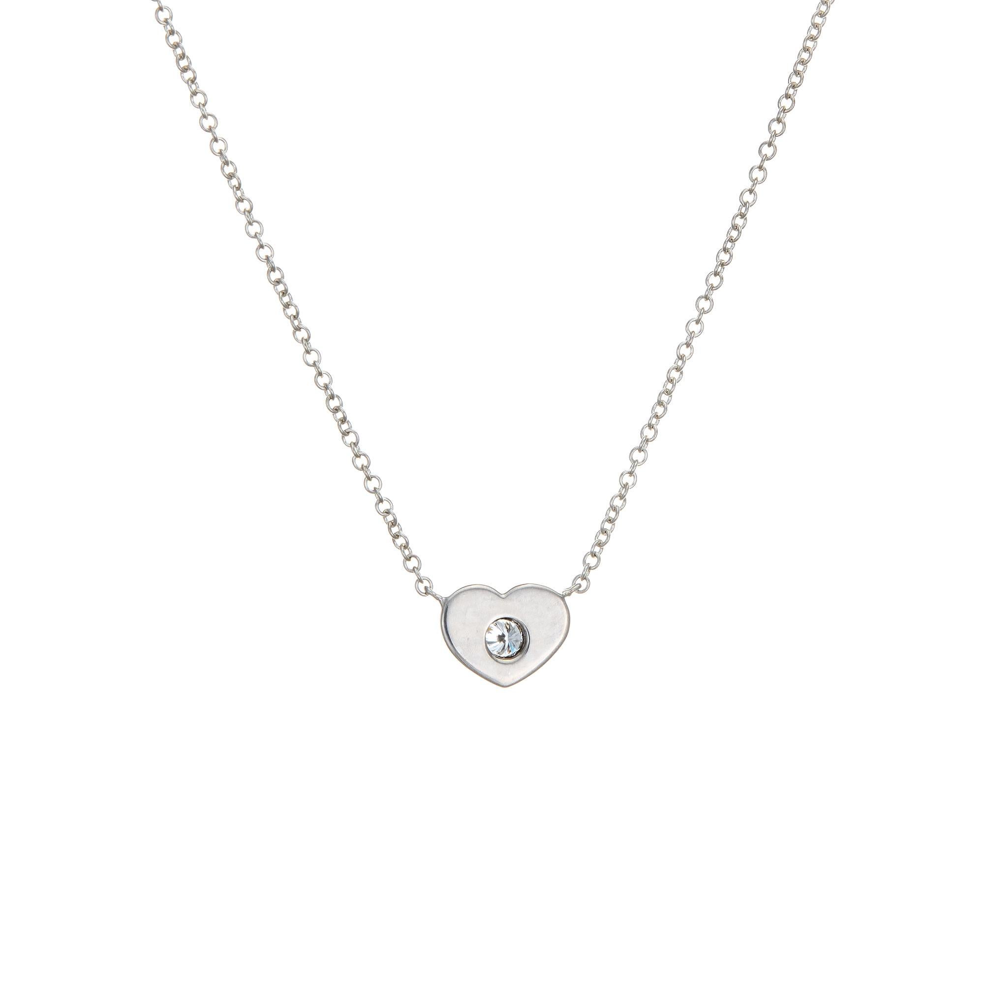 Elegant and finely detailed estate Tiffany & Co diamond heart necklace, crafted in sterling silver.  

Round brilliant cut diamond is estimated at 0.03 carats (estimated at H-I color and VVS2 clarity). 

The necklace is a retired piece and no longer