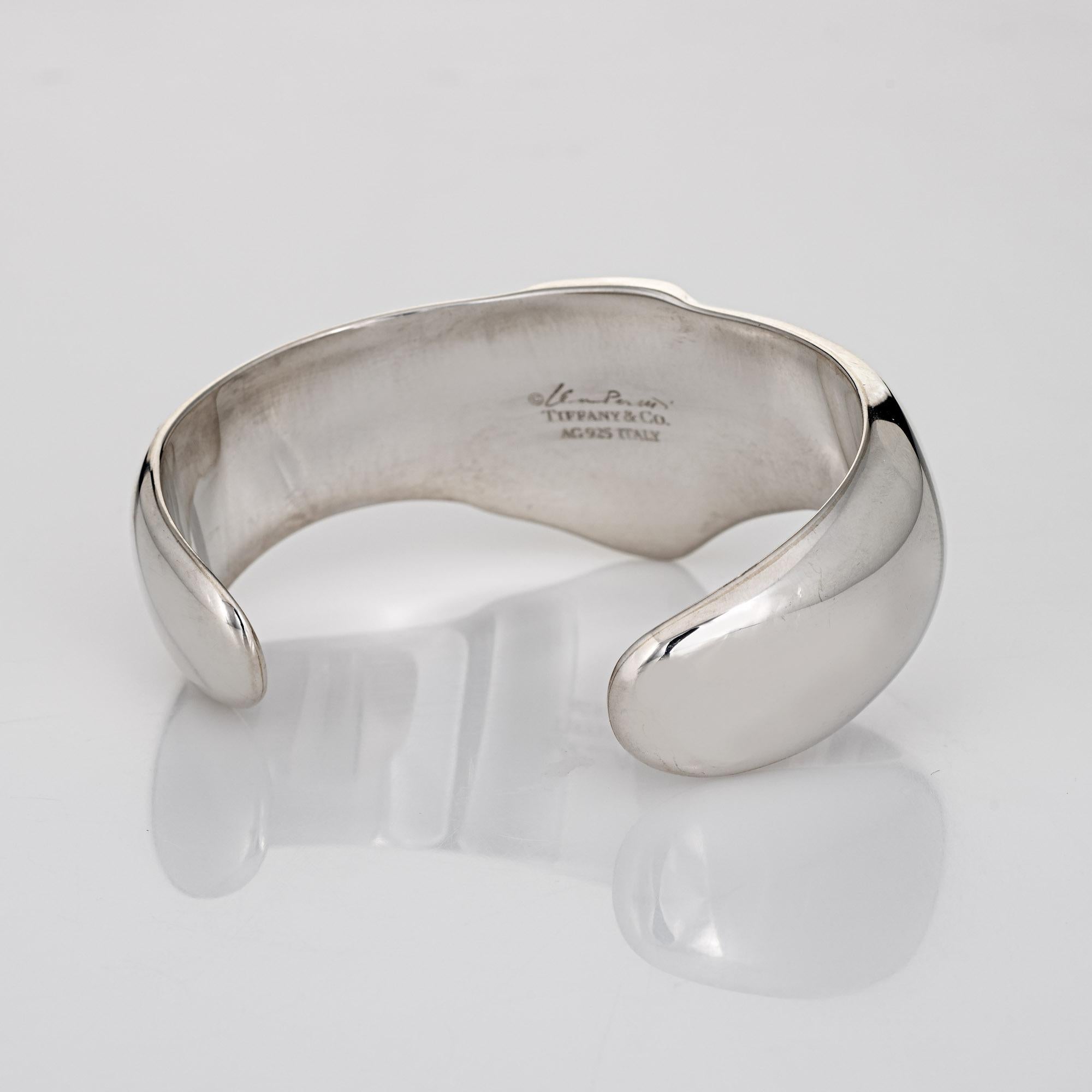 Stylish and finely detailed estate Tiffany & Co flat knot cuff bracelet, crafted in sterling silver.  

The flat knot cuff bracelet is wide (28mm - 1.10 inches) and makes a great statement on the wrist. The bracelet is designed to fit a wrist up to